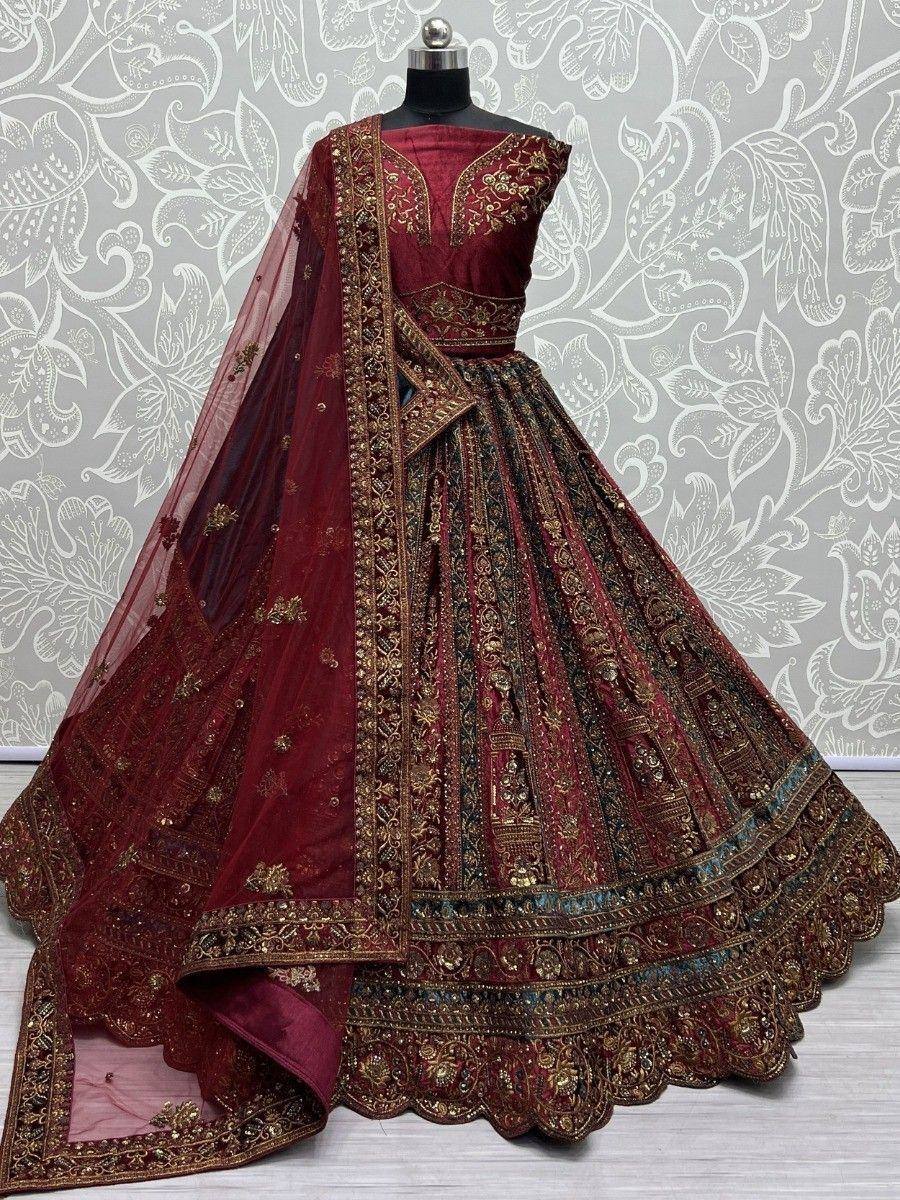 Maroon designer lehenga choli with heavy gold embroidery and net dupatta, perfect for weddings