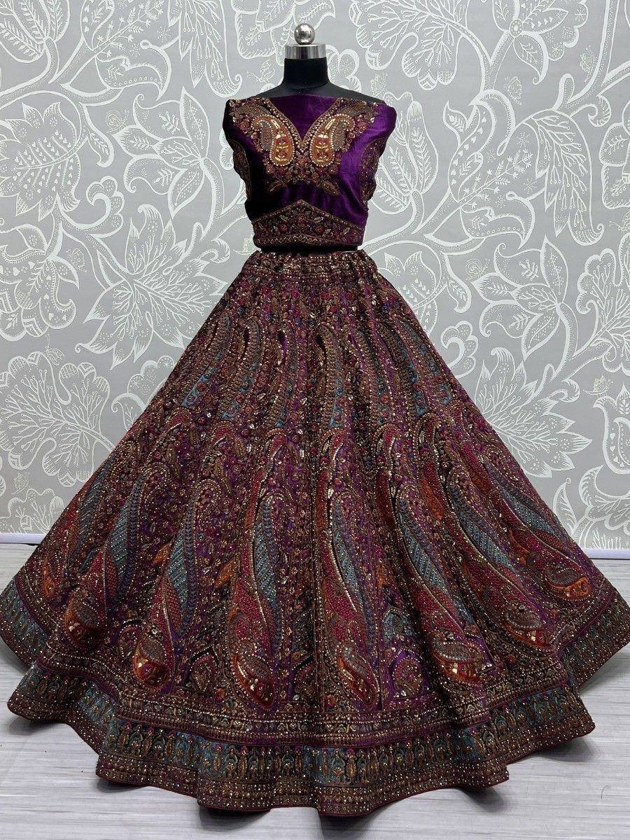 Purple and maroon embroidered lehenga choli with paisley motifs, perfect for Indian ethnic wear occasions.
