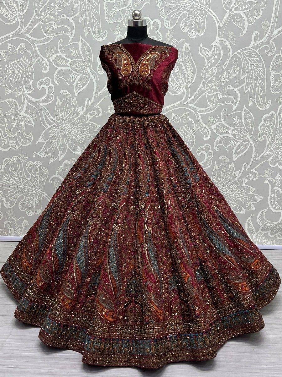 Maroon designer lehenga choli with intricate paisley embroidery and sequin work, perfect for Indian weddings.