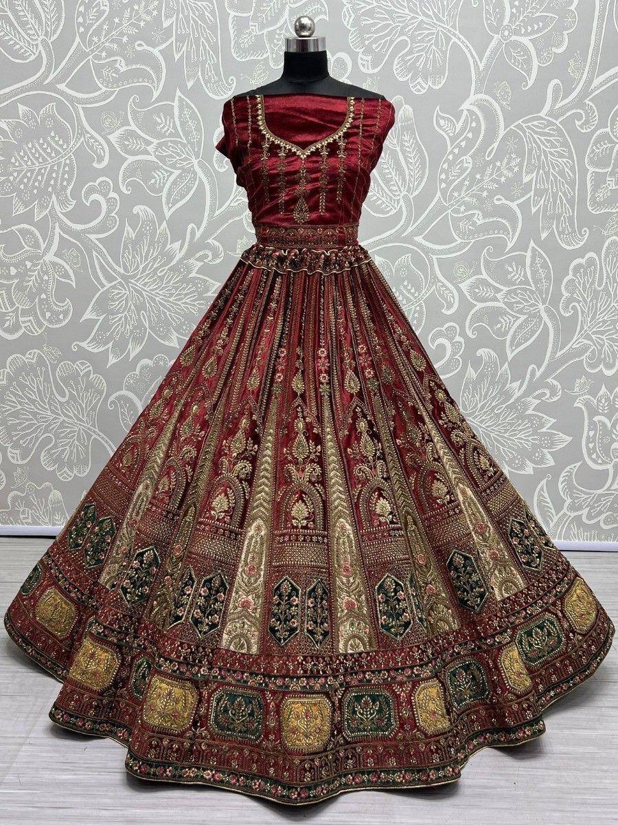 Maroon designer lehenga choli with gold embroidery, perfect for Indian weddings and festive occasions.