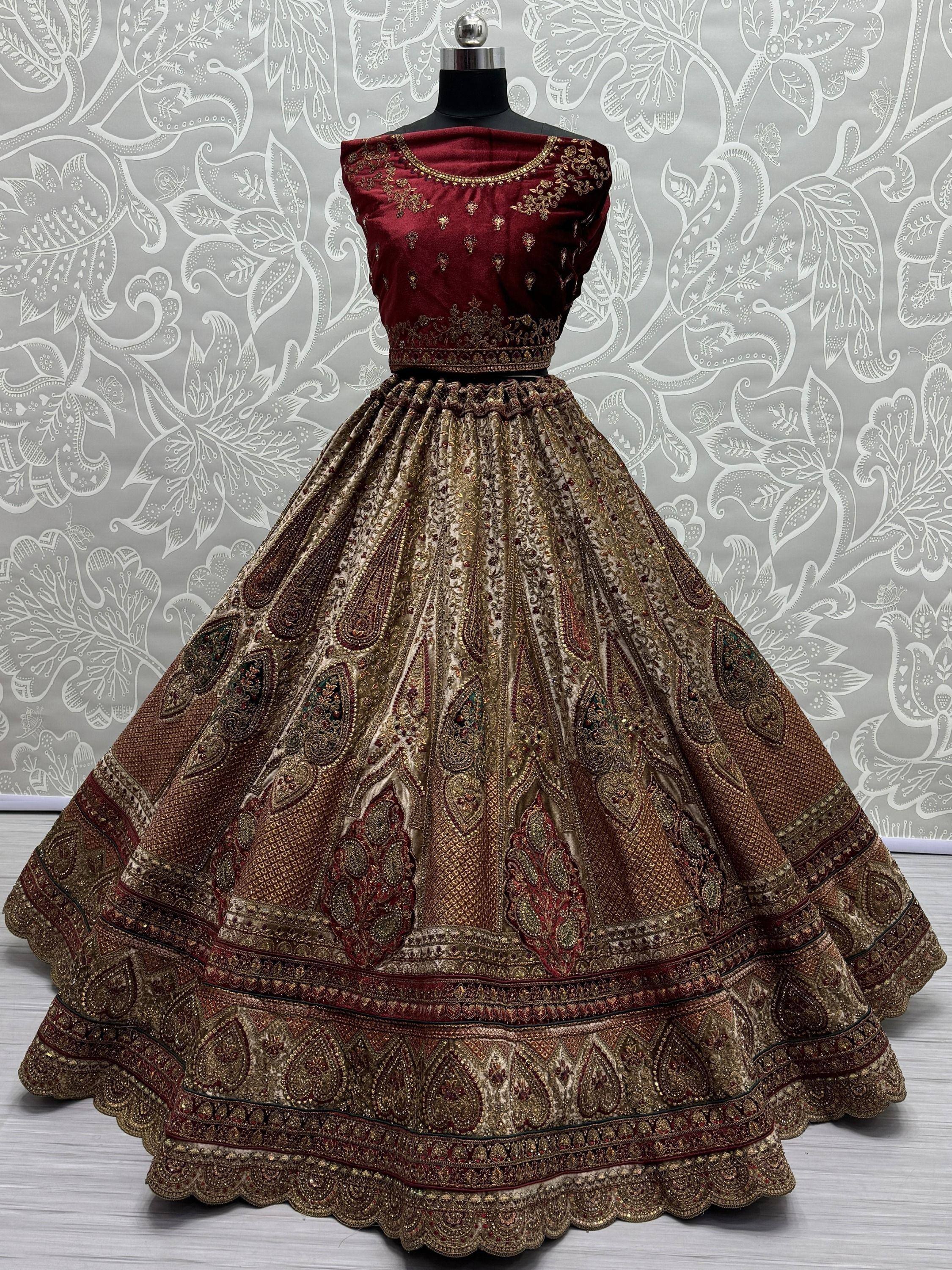 Maroon and gold embroidered lehenga choli with intricate paisley design, perfect for Indian ethnic wear