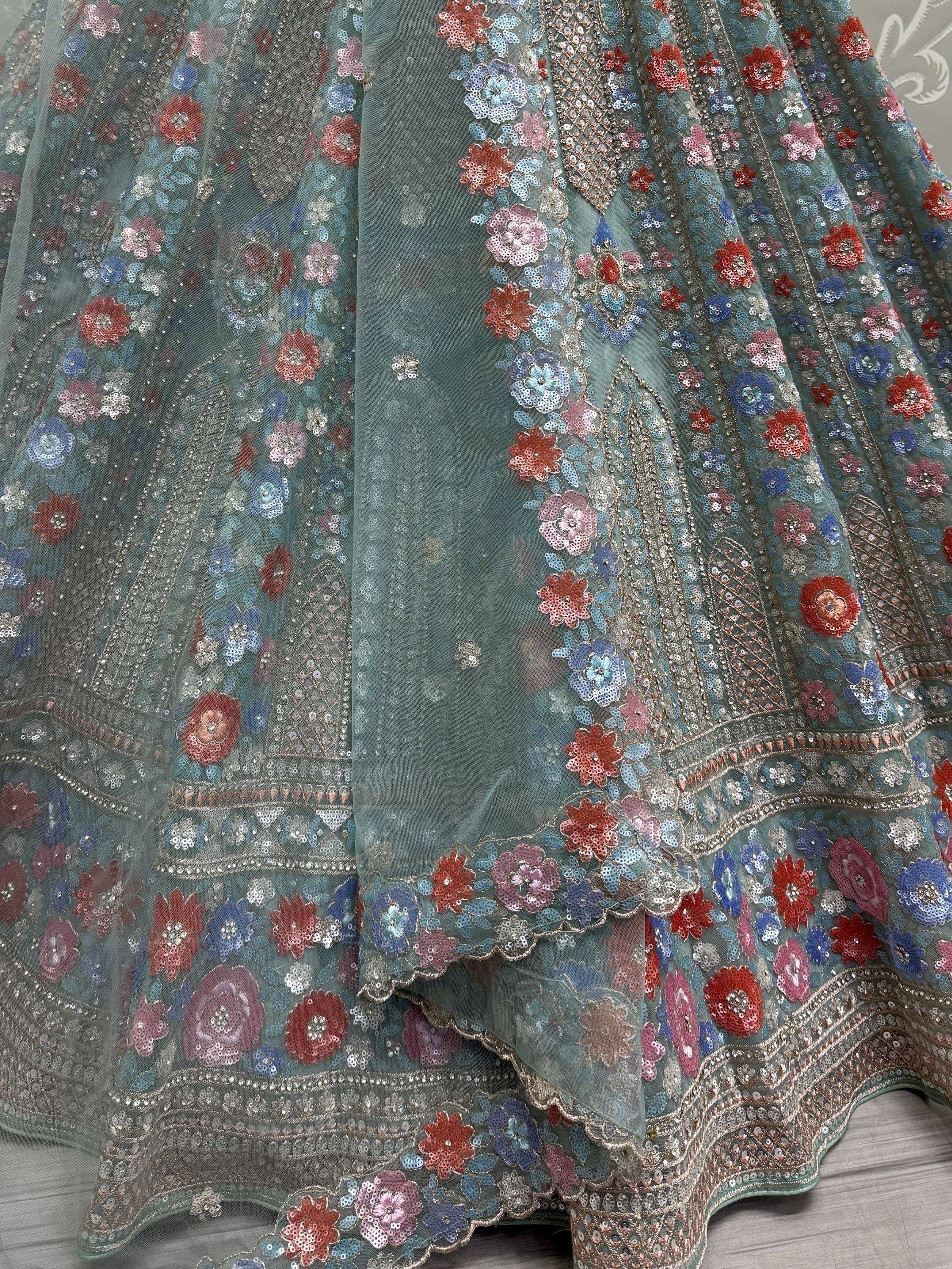 Teal floral sequin lehenga choli with intricate embroidery, perfect for Indian ethnic wear events.