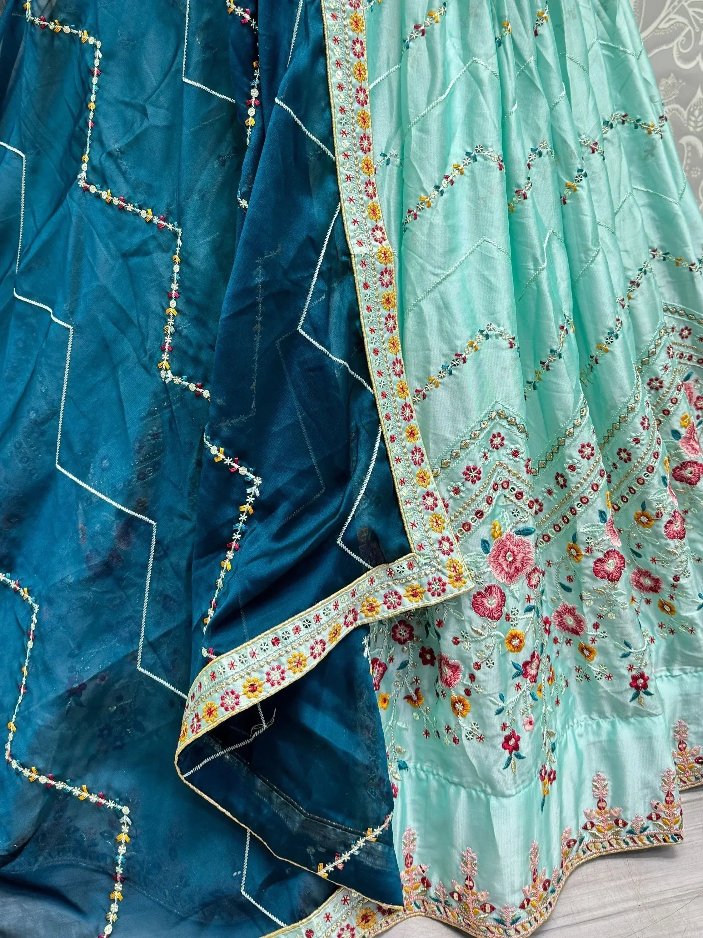 Teal and mint green embroidered lehenga choli with floral motifs and mirror work, Indian ethnic wear