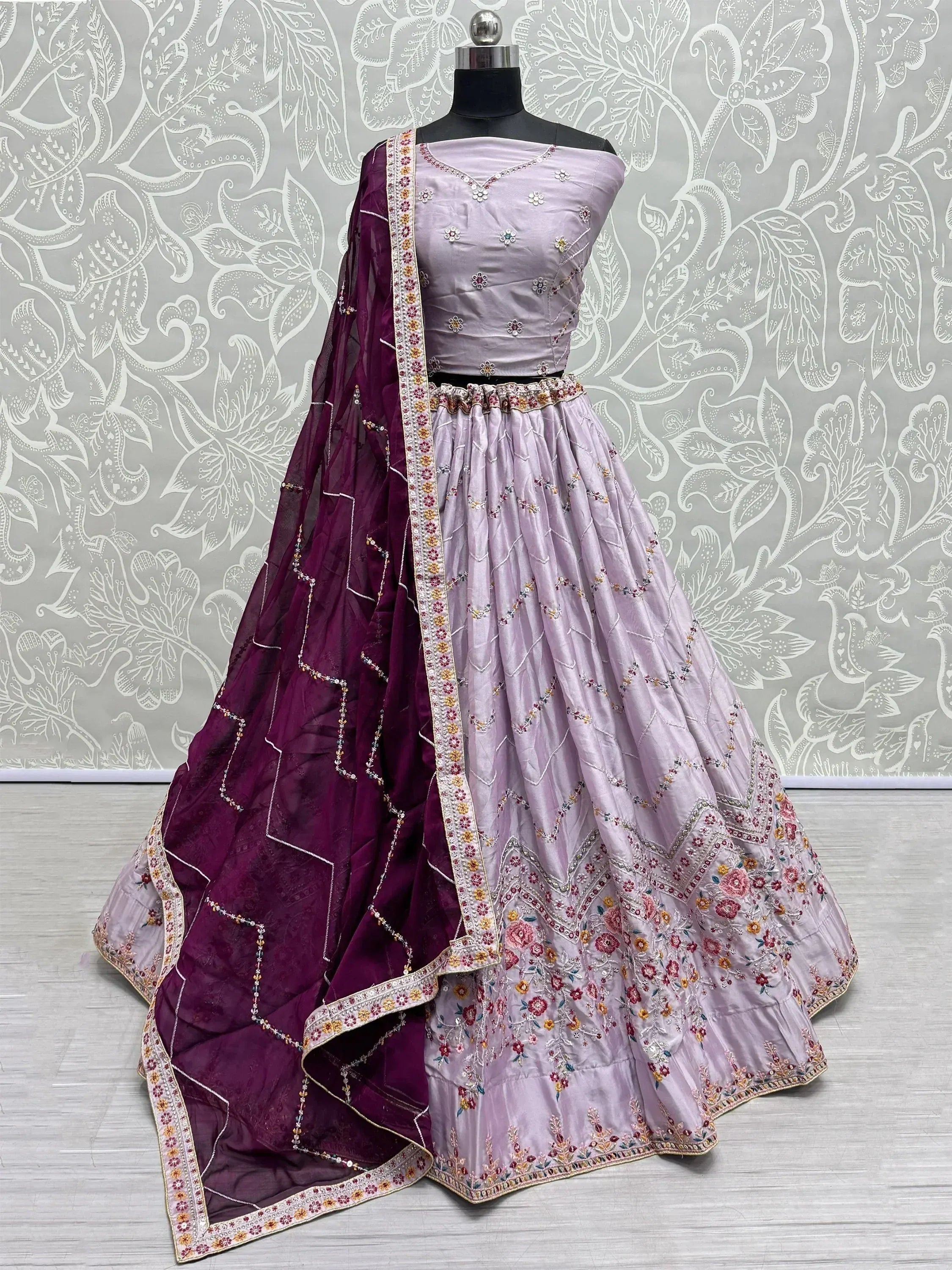 Lavender embroidered lehenga choli with purple dupatta, floral motifs, perfect for Indian ethnic occasions