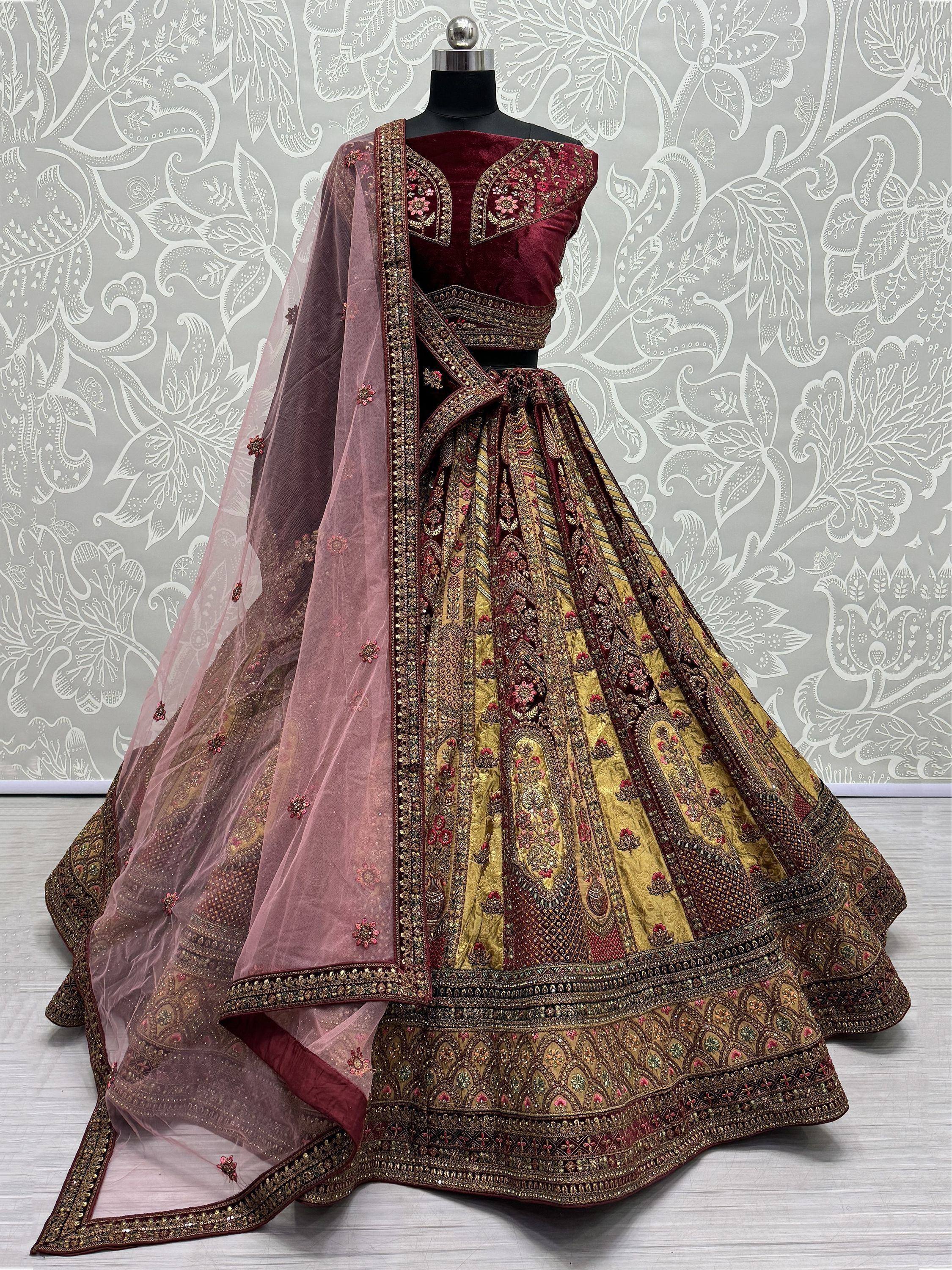 Maroon and gold embroidered lehenga choli with sheer dupatta, perfect for Indian ethnic wear
