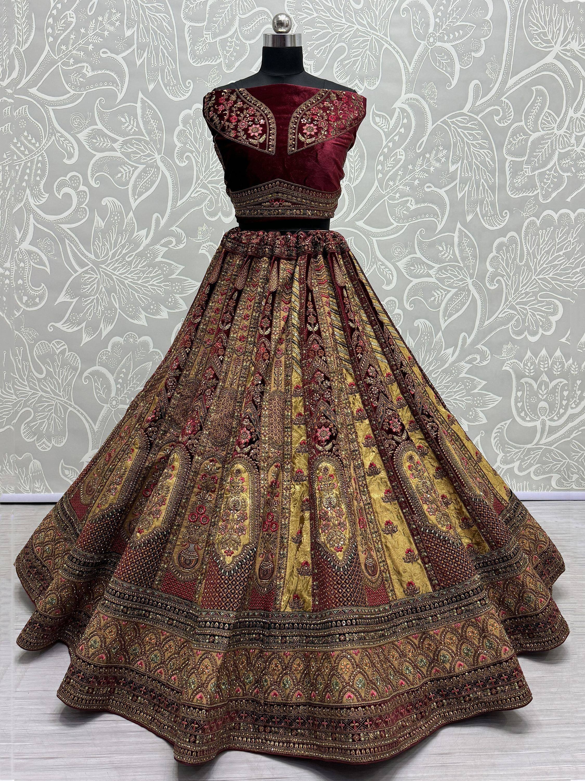 Maroon and gold embroidered lehenga choli with intricate floral designs, perfect for Indian ethnic wear.