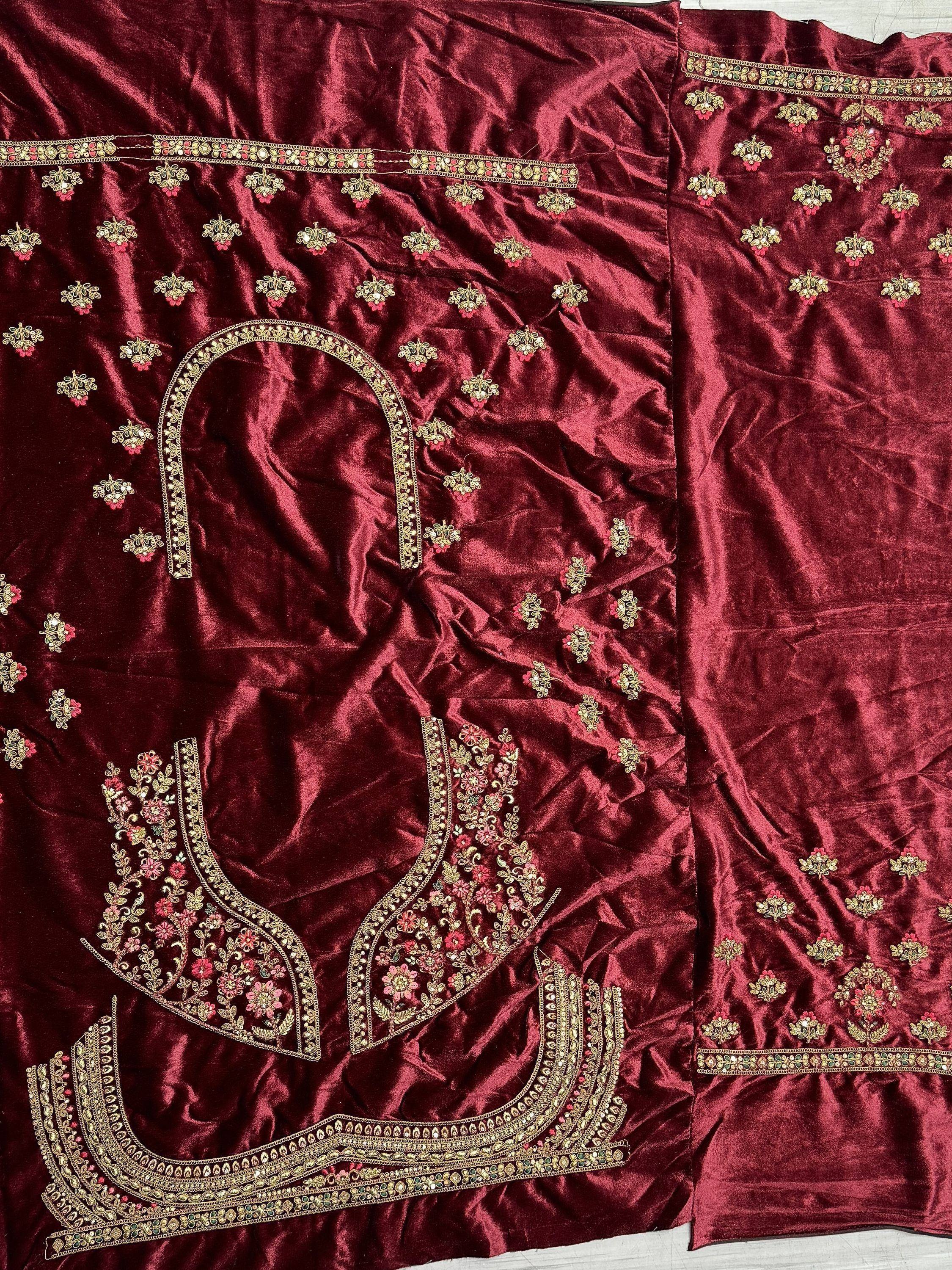 Maroon velvet designer lehenga choli with gold floral embroidery and embellished borders