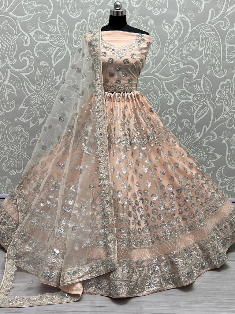 Dazzling Peach Sequins Net Engagement Wear Lehenga Choli