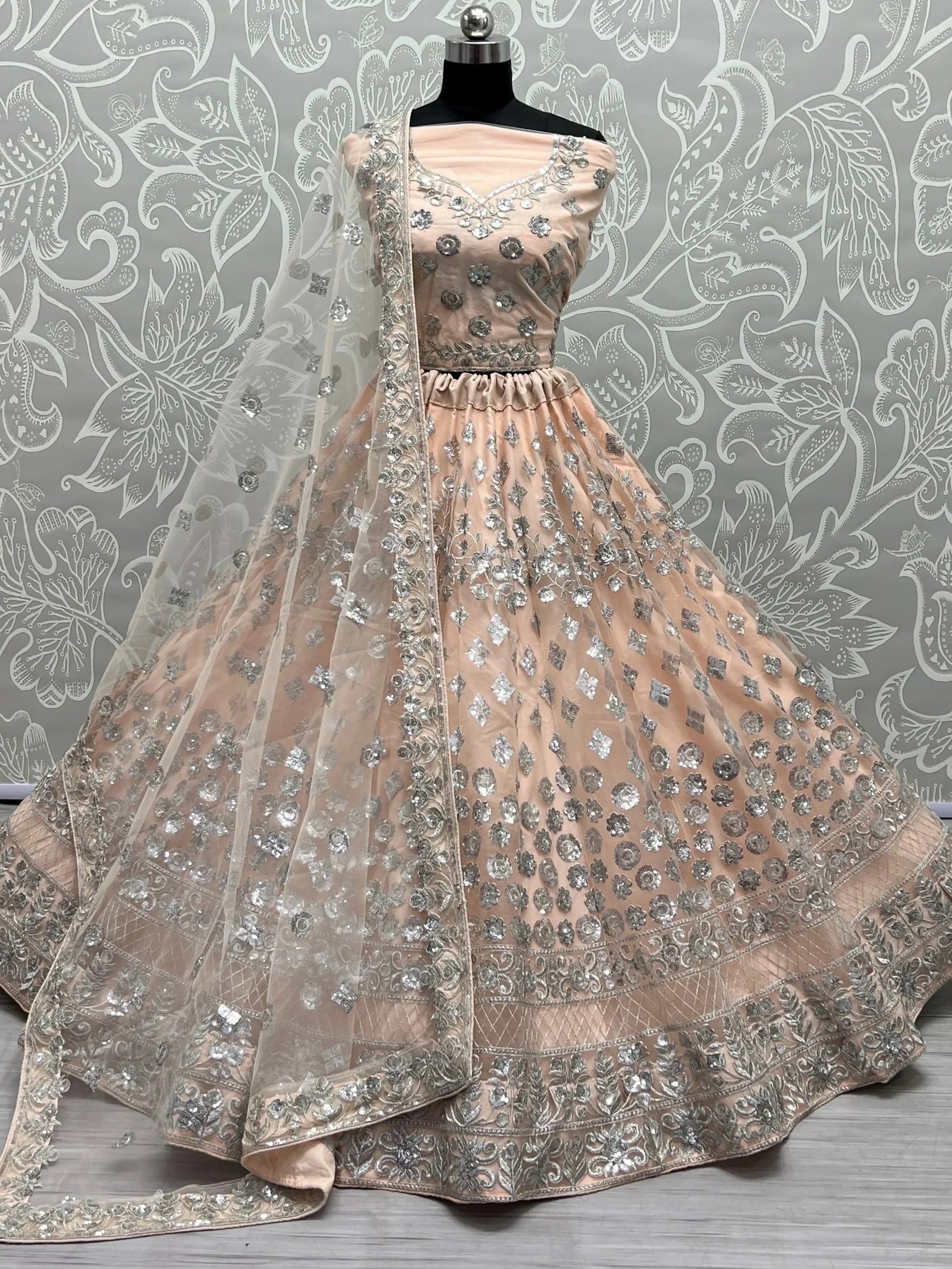 Dazzling Peach Sequins Net Engagement Wear Lehenga Choli