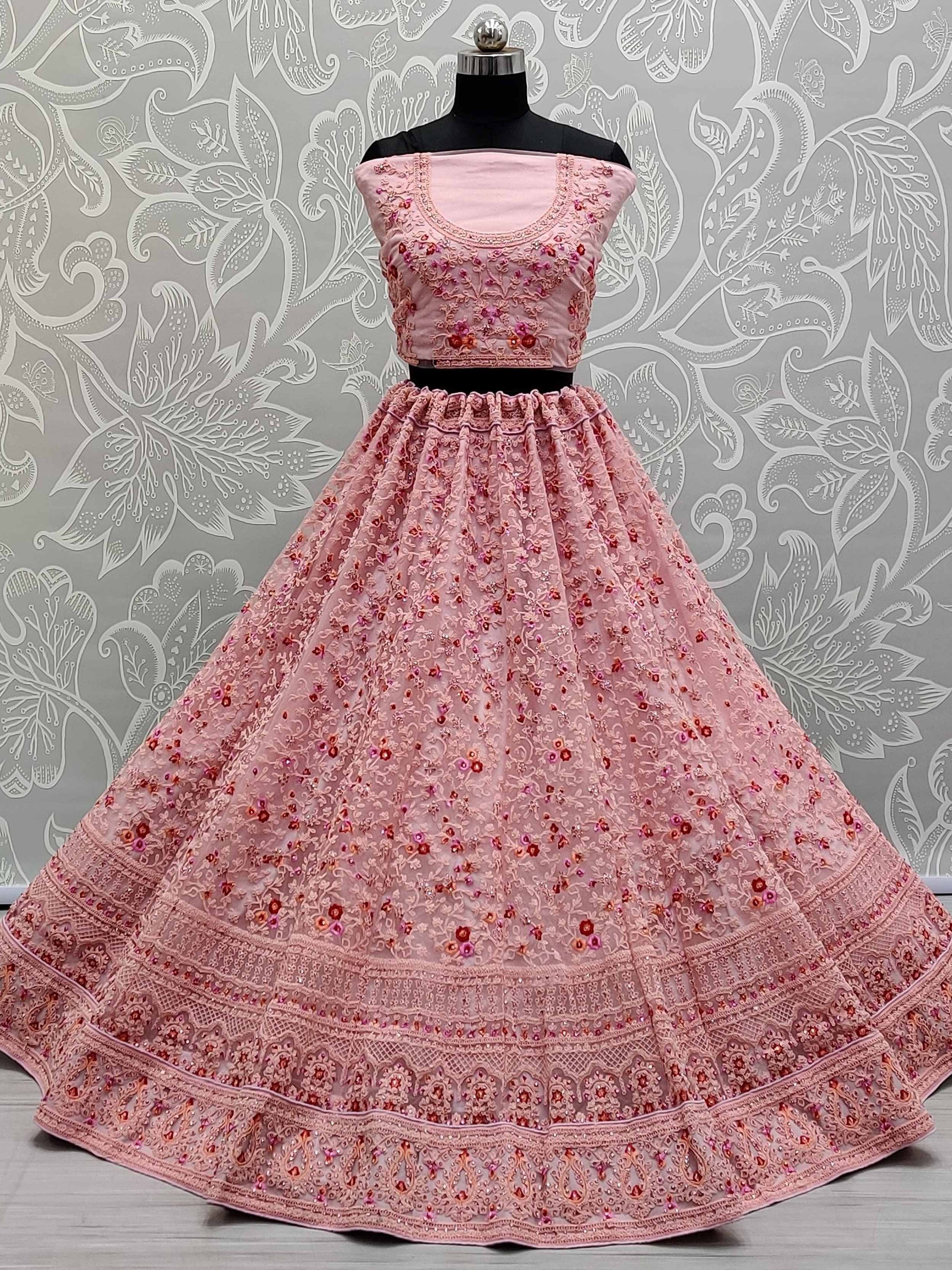 Pink embroidered lehenga choli with floral motifs, perfect for Indian ethnic wear occasions