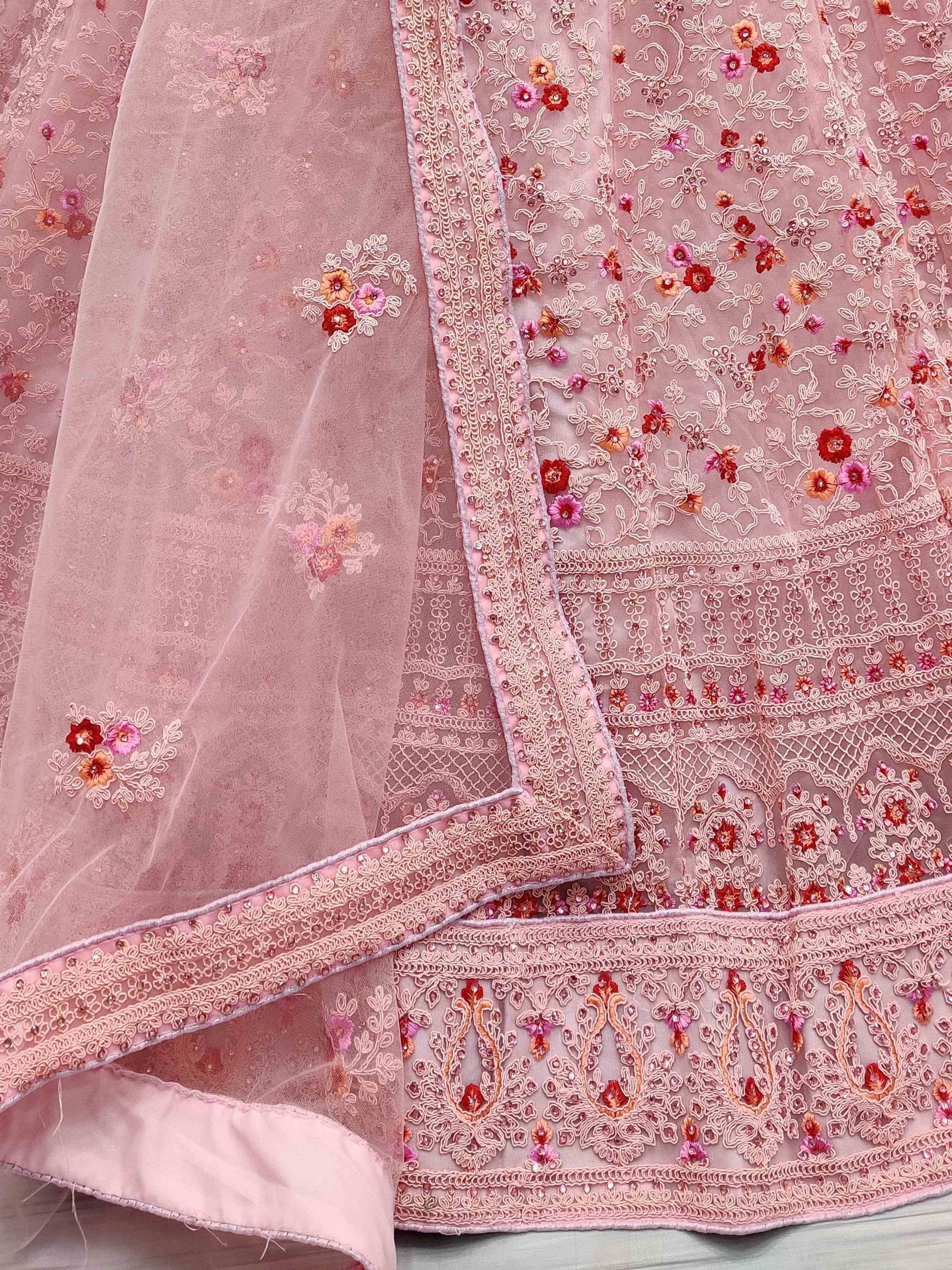 Pink embroidered lehenga choli with floral motifs and sequin detailing, ideal for Indian ethnic wear.