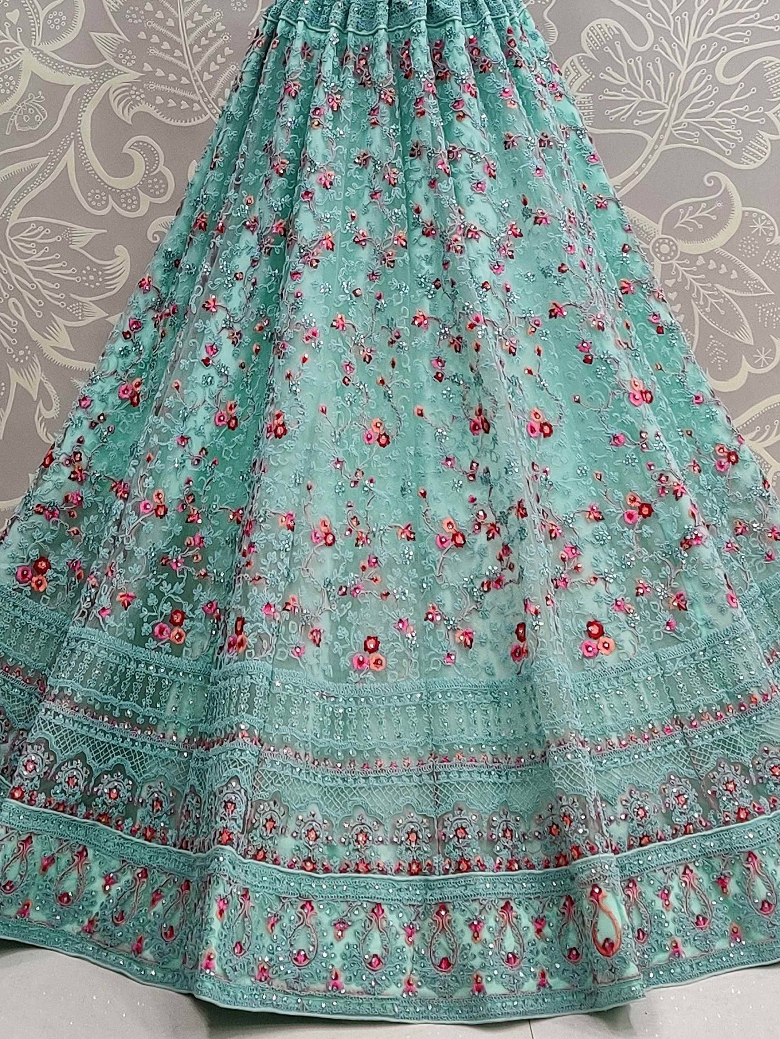 Mint green embroidered lehenga with floral motifs and intricate detailing