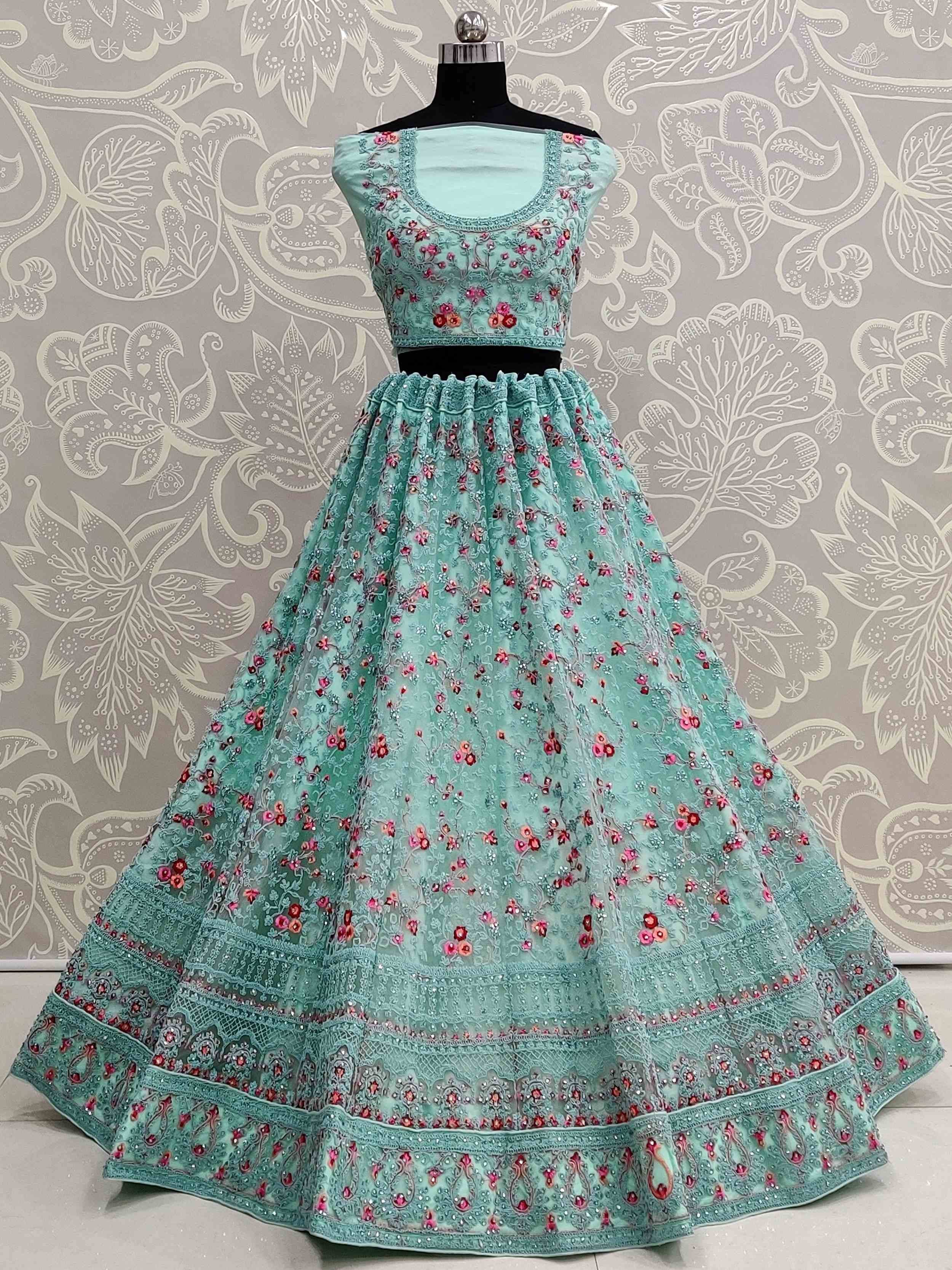 Mint green embroidered lehenga choli with floral designs and intricate detailing