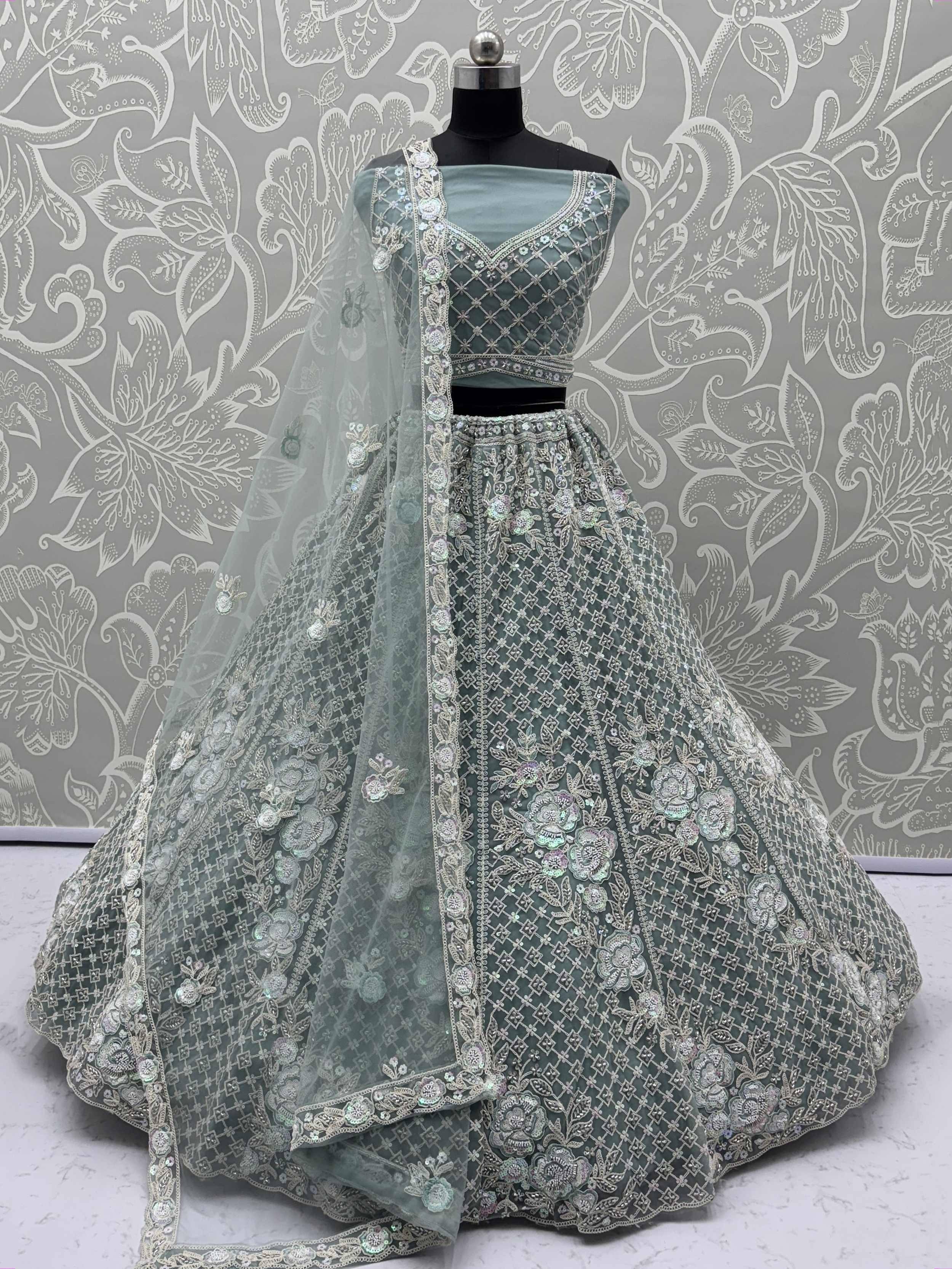 Mint green designer lehenga choli with heavy floral embroidery and sequin work, perfect for weddings and parties