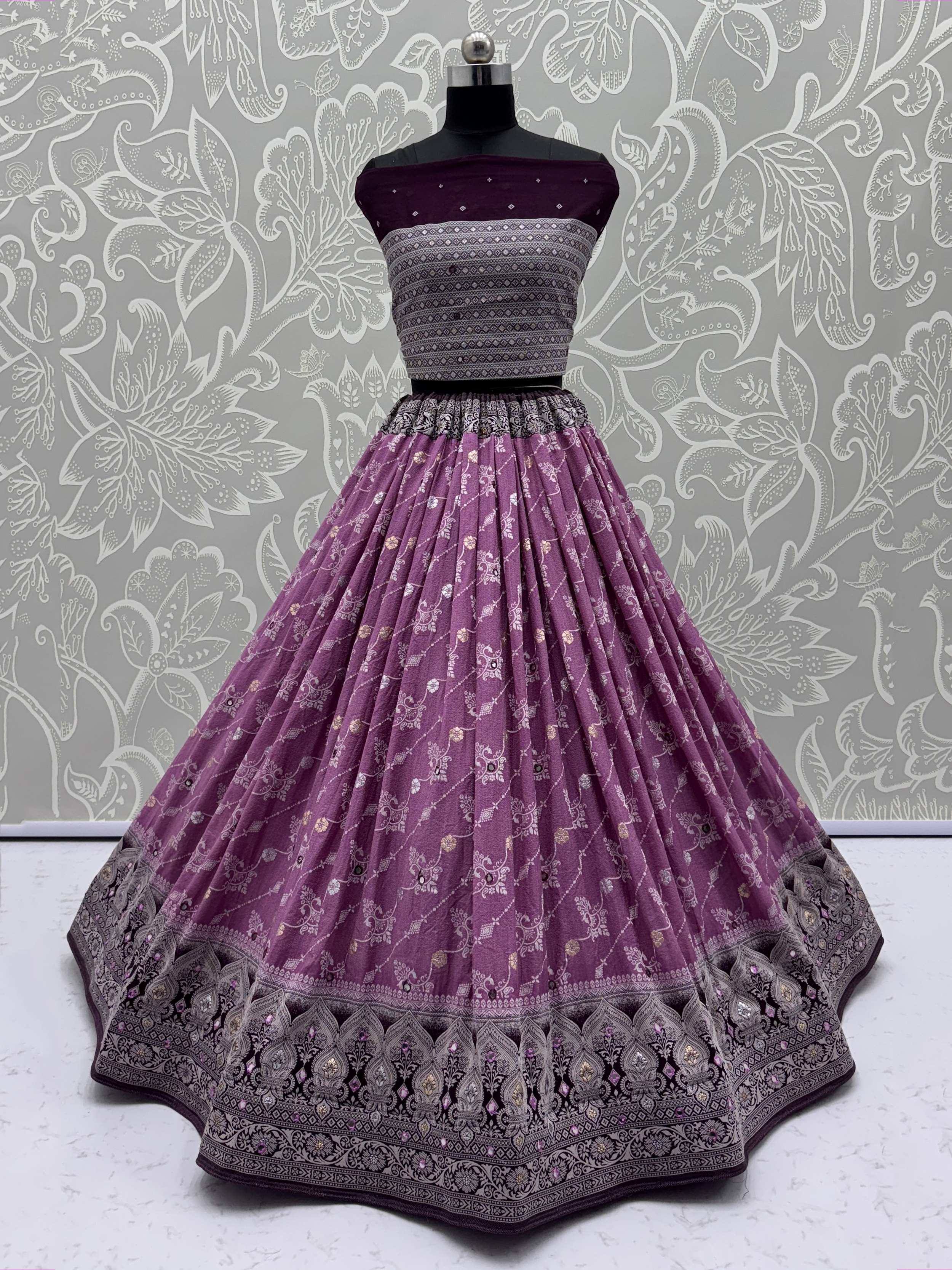 Purple designer lehenga choli with intricate embroidery and floral patterns, perfect for Indian ethnic wear.