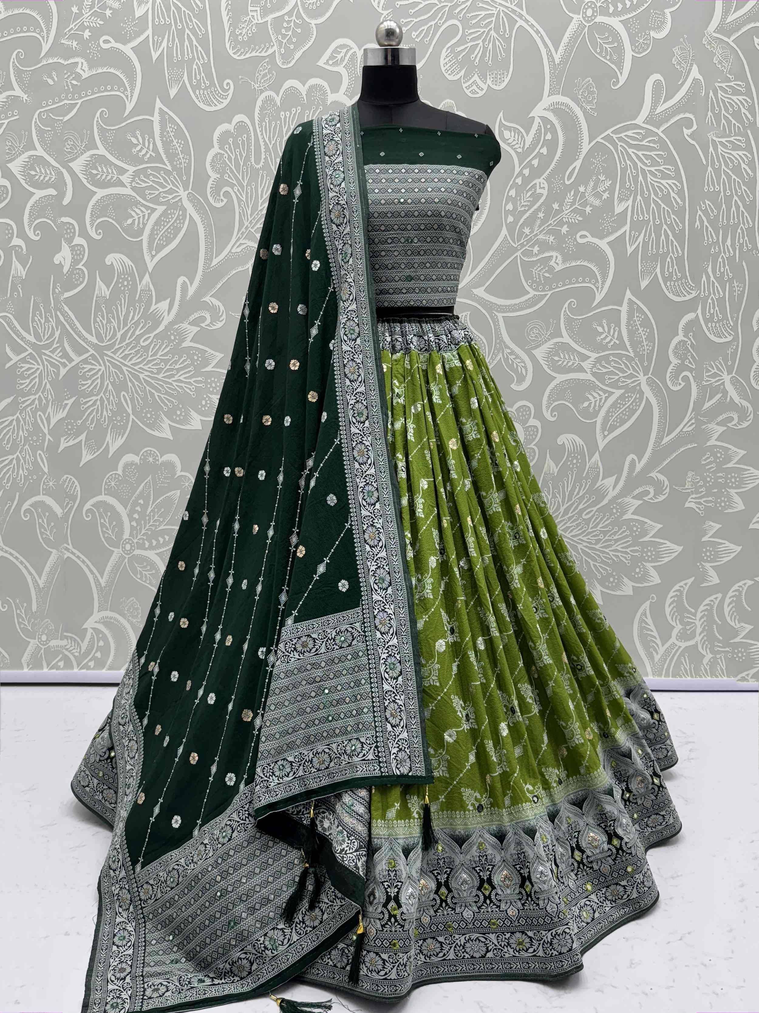 Green designer lehenga choli with intricate silver embroidery and matching dupatta, perfect for Indian ethnic wear.