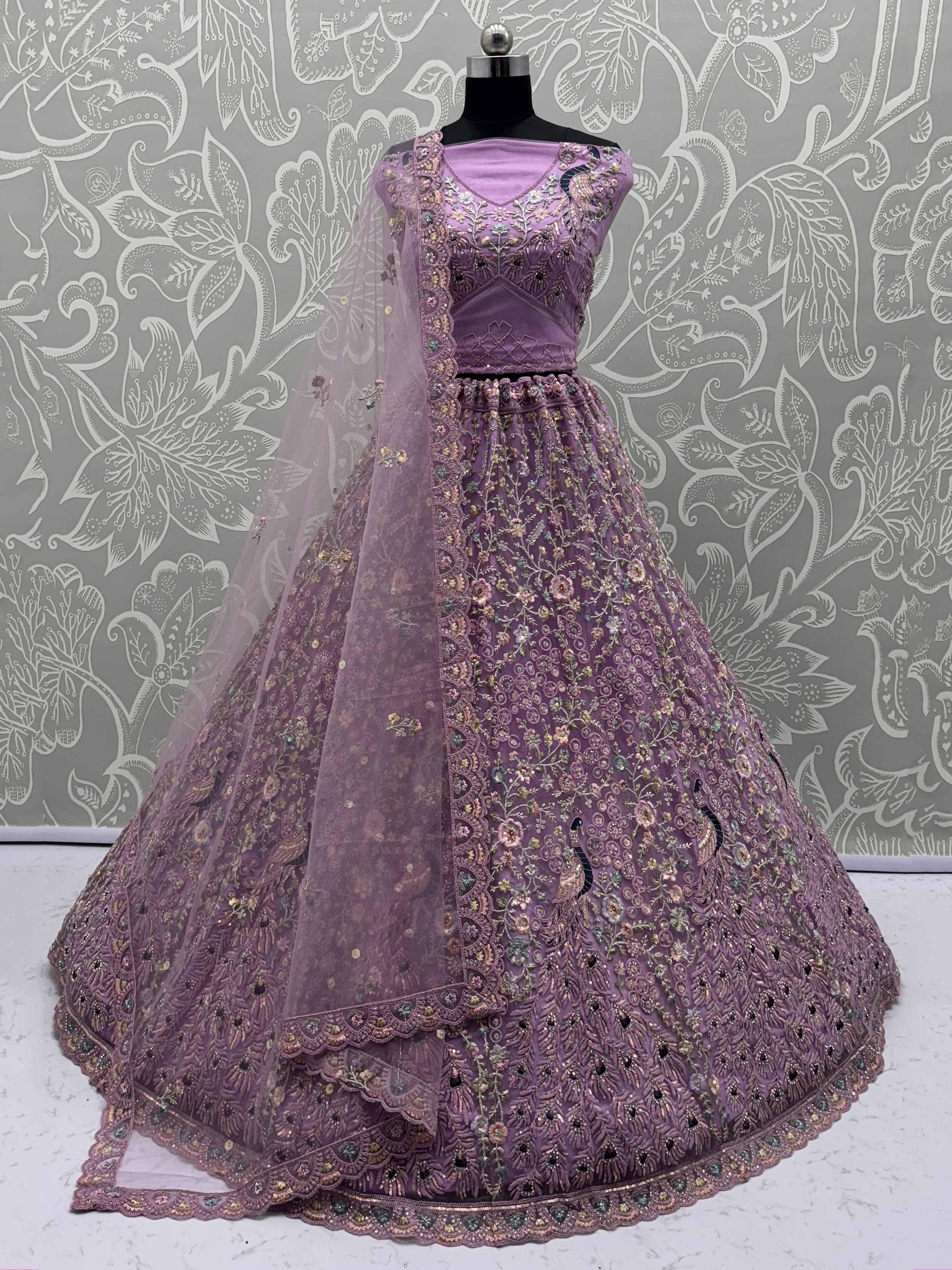 Purple embroidered lehenga choli with floral and peacock motifs, perfect for Indian ethnic wear events