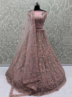 Magnetic Peach Net Sequins Wedding Wear Lehenga Choli With Dupatta
