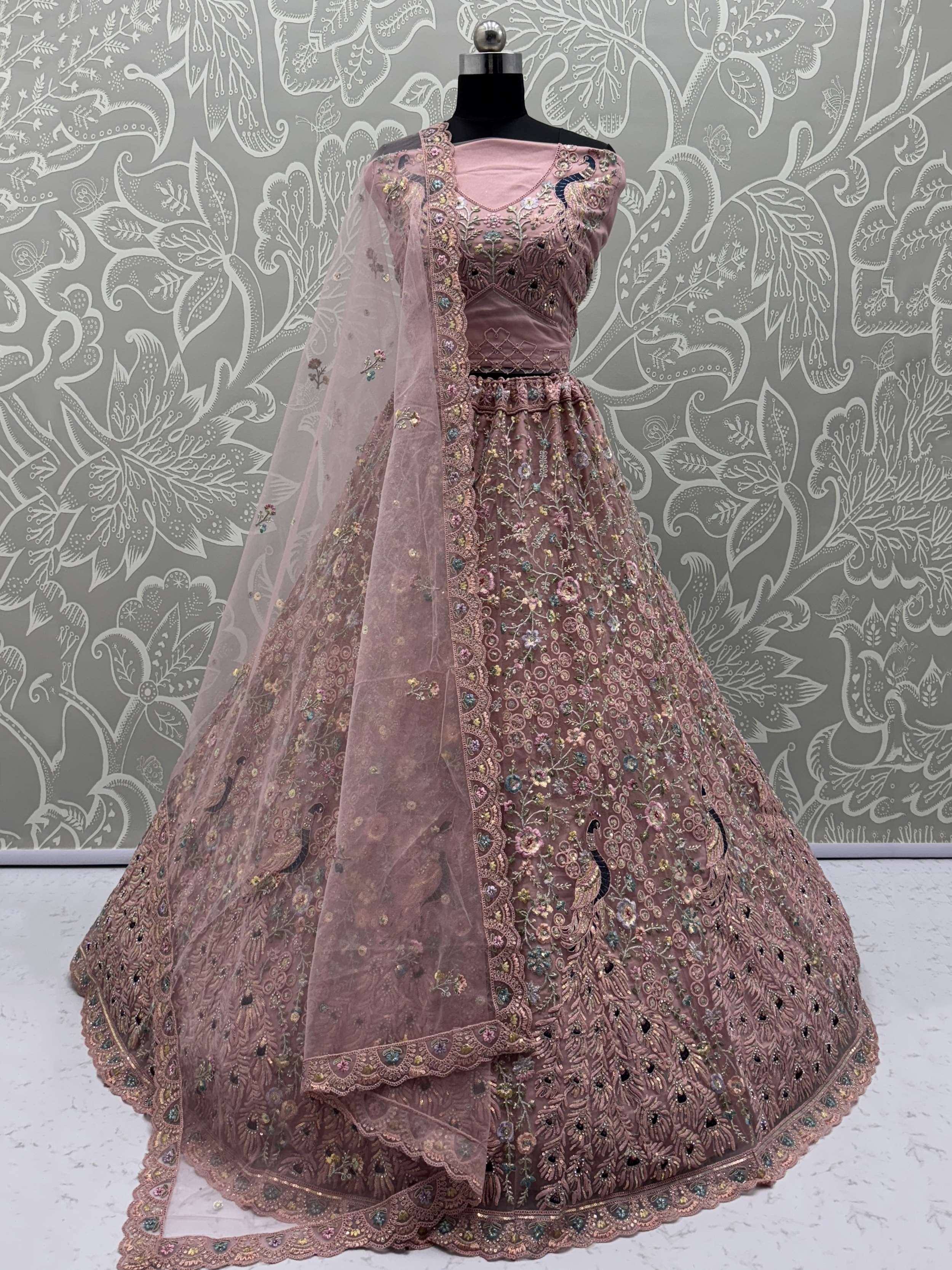 Pink embroidered lehenga choli with peacock motifs and sheer dupatta, Indian ethnic wear