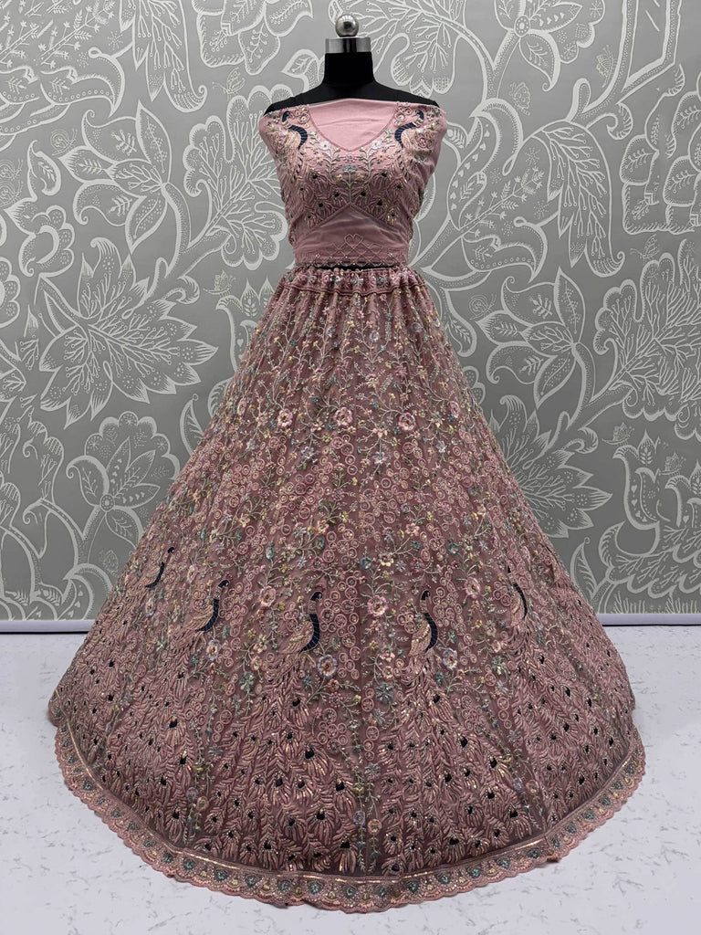 Magnetic Peach Net Sequins Wedding Wear Lehenga Choli With Dupatta