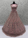 Magnetic Peach Net Sequins Wedding Wear Lehenga Choli With Dupatta