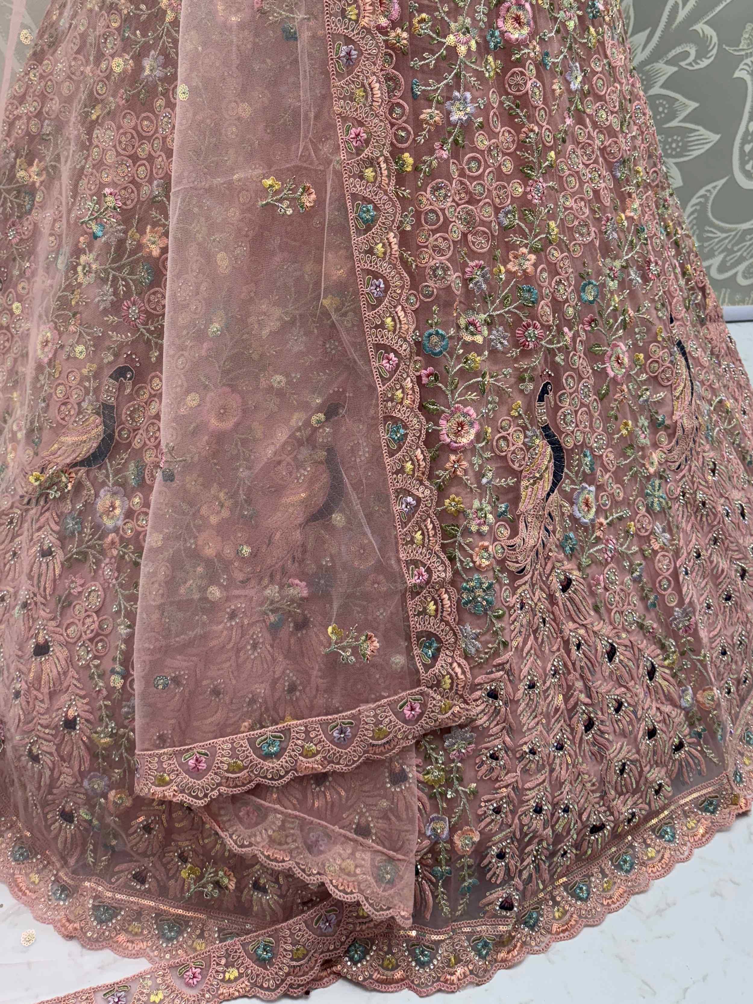 Pink embroidered lehenga with peacock and floral motifs, perfect for Indian ethnic wear