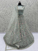 Dazzling Sky Blue Net Zari Embroidered Reception Wear Lehenga Choli