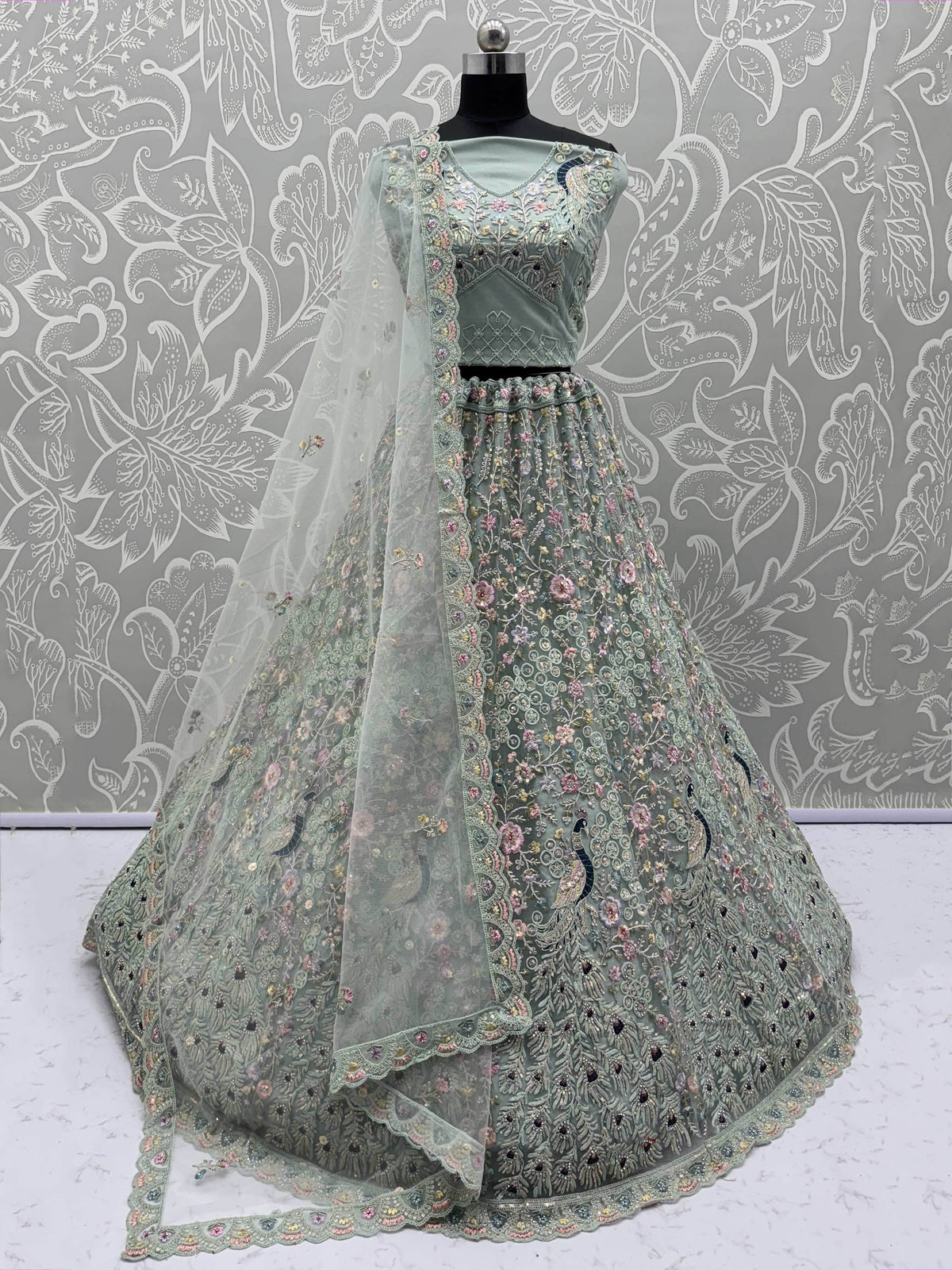 Dazzling Sky Blue Net Zari Embroidered Reception Wear Lehenga Choli