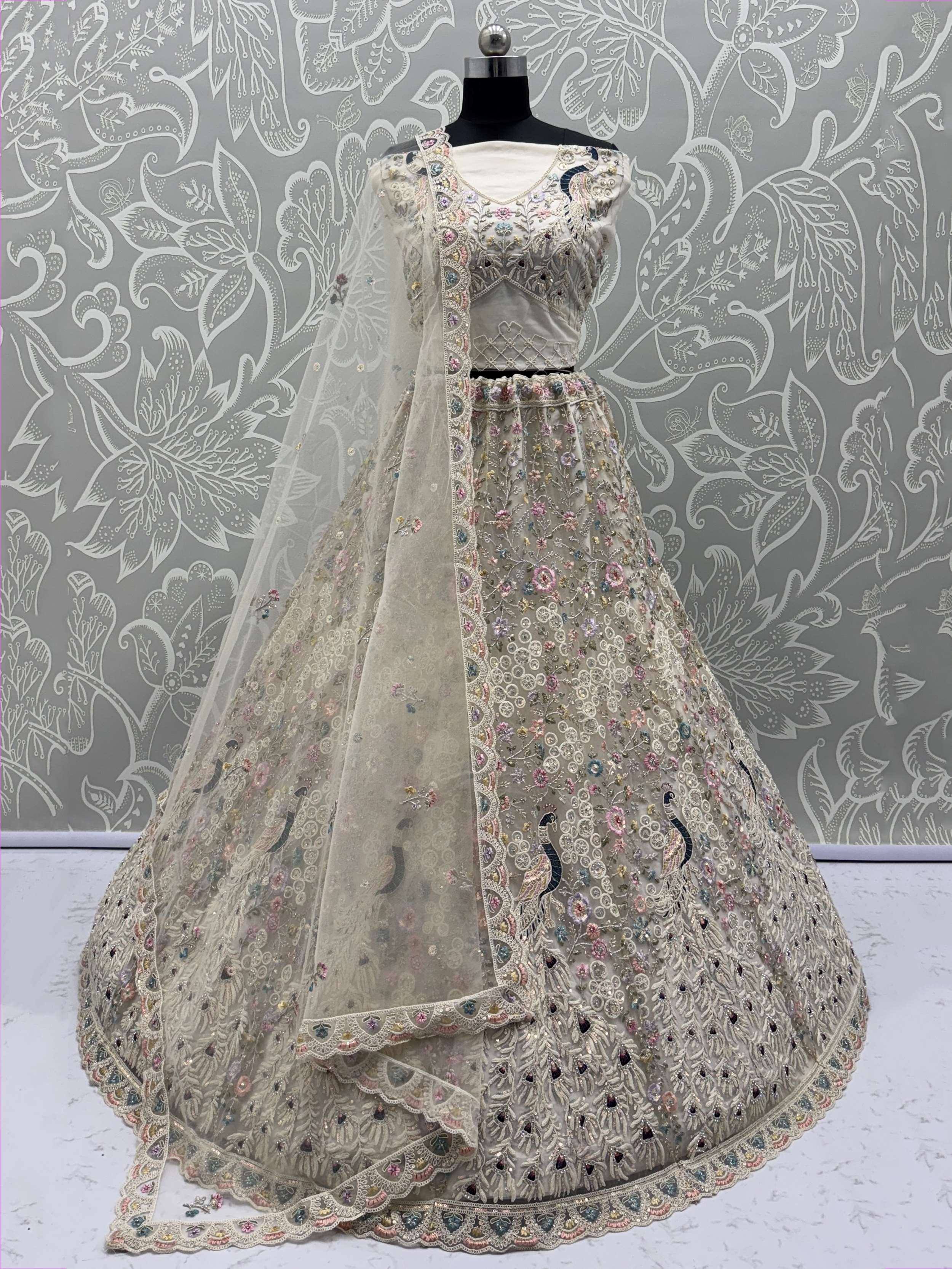Designer lehenga choli with floral and peacock embroidery, perfect for Indian weddings and festive occasions.