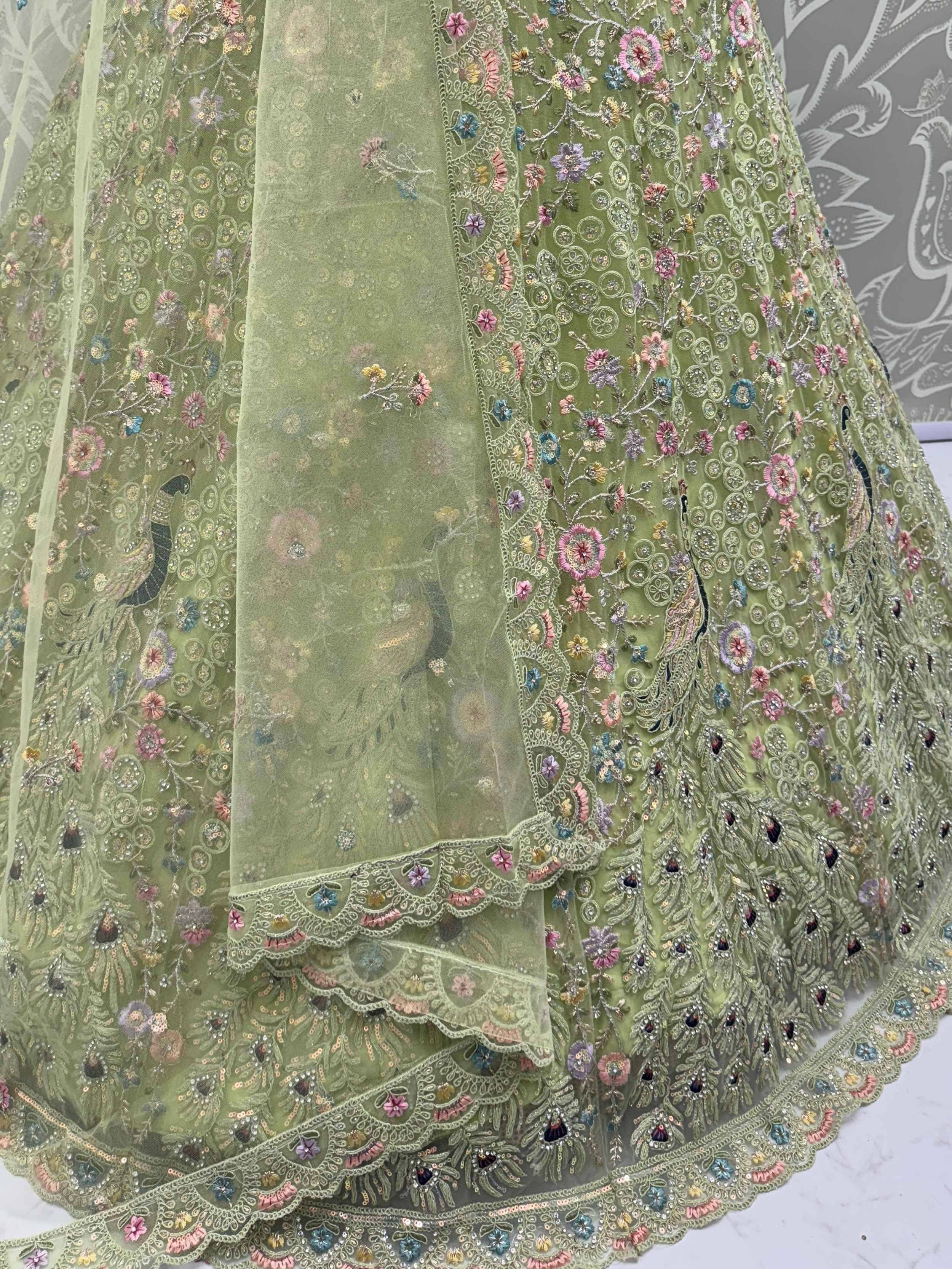 Green embroidered lehenga with floral and peacock motifs, perfect for Indian ethnic wear