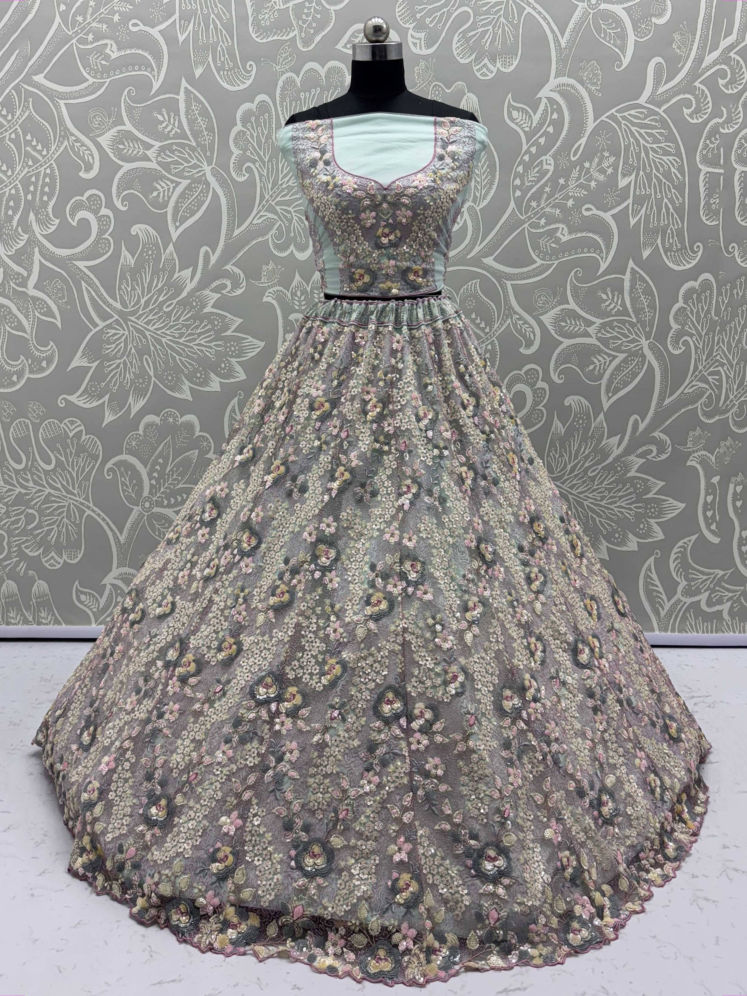 Mint green designer lehenga choli with floral embroidery and sequins, perfect for Indian ethnic wear