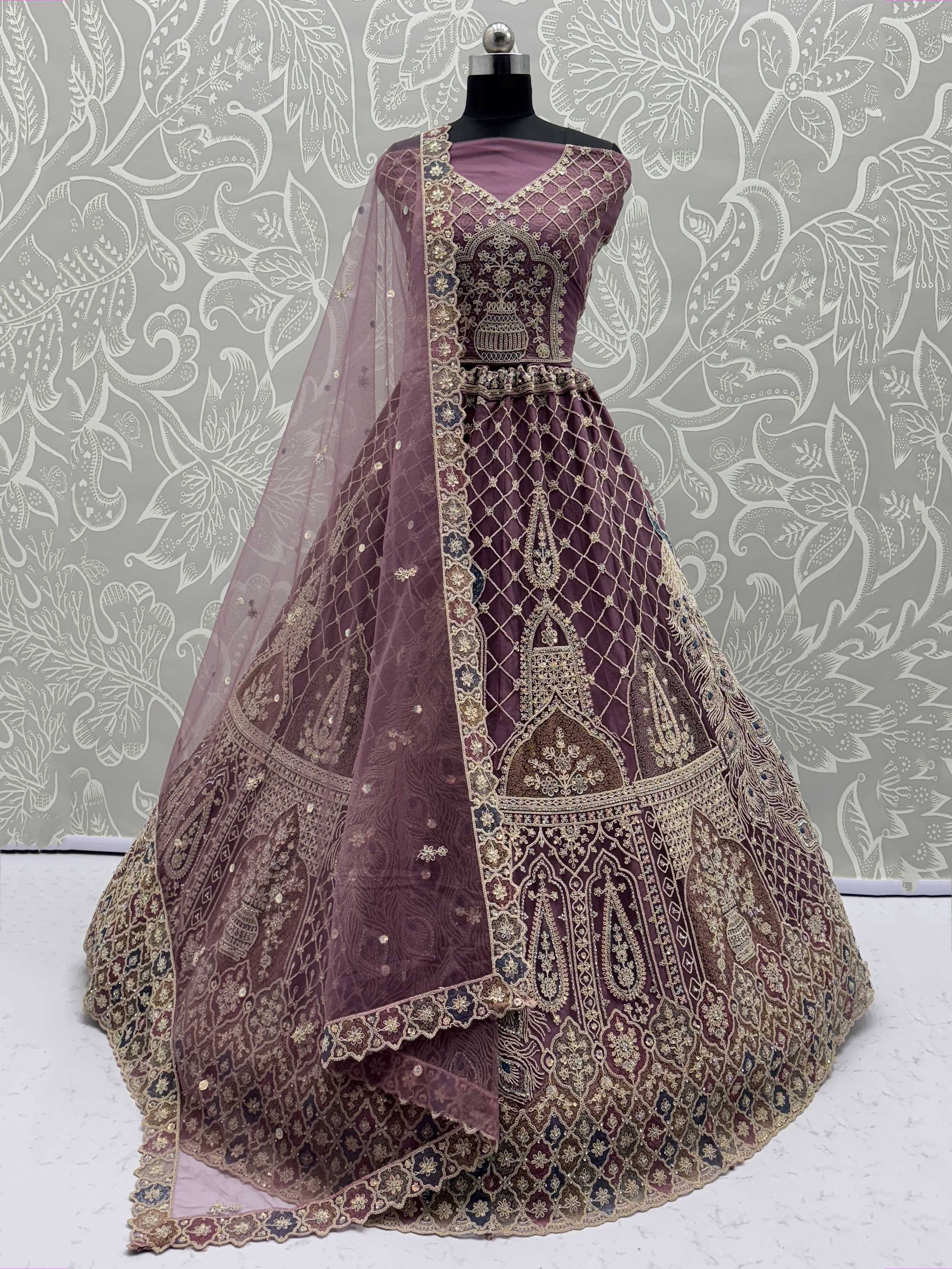 Elegant purple lehenga choli with gold embroidery and net dupatta, perfect for Indian ethnic wear occasions