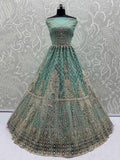 Mesmerizing Green Net Stone Work Reception Wear Lehenga Choli