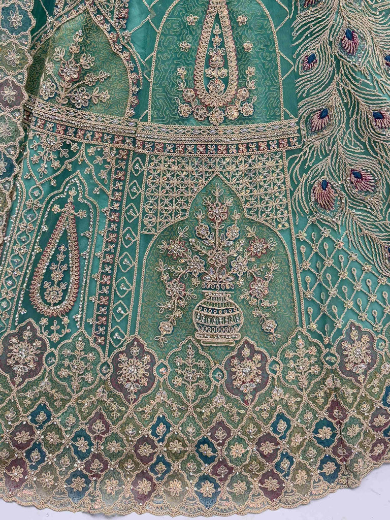 Mesmerizing Green Net Stone Work Reception Wear Lehenga Choli