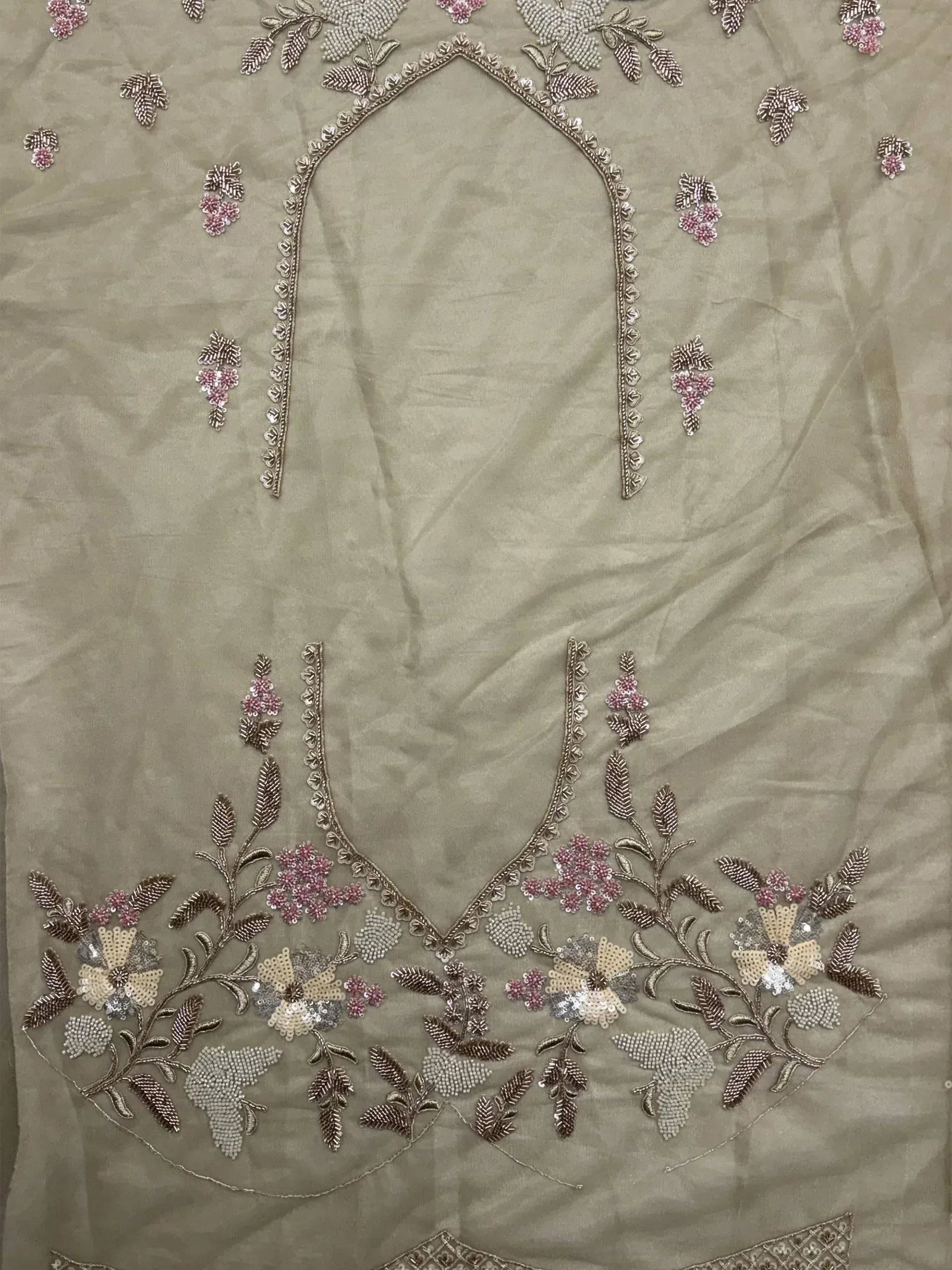 Beige ethnic wear with floral embroidery and sequin detailing, perfect for Indian designer lehenga or salwar kameez.