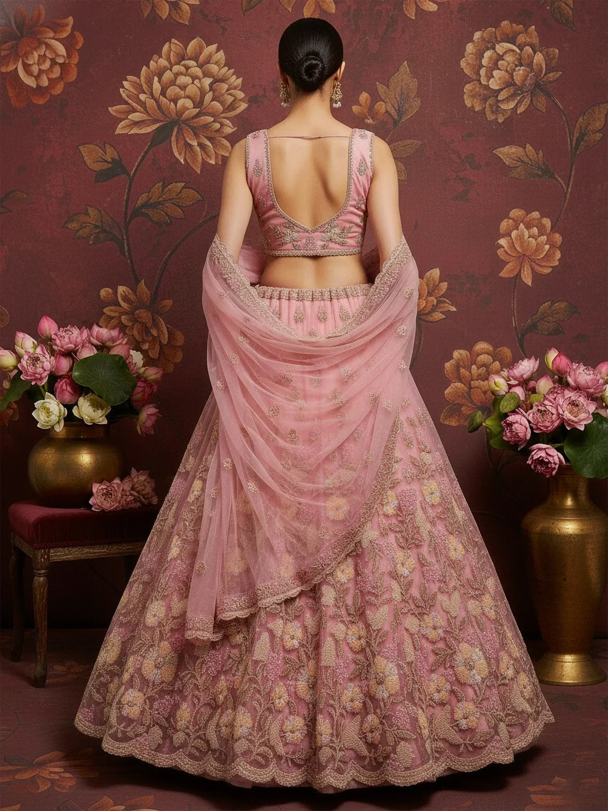 Pink embroidered lehenga choli with floral detailing and sheer dupatta, perfect for Indian ethnic wear.