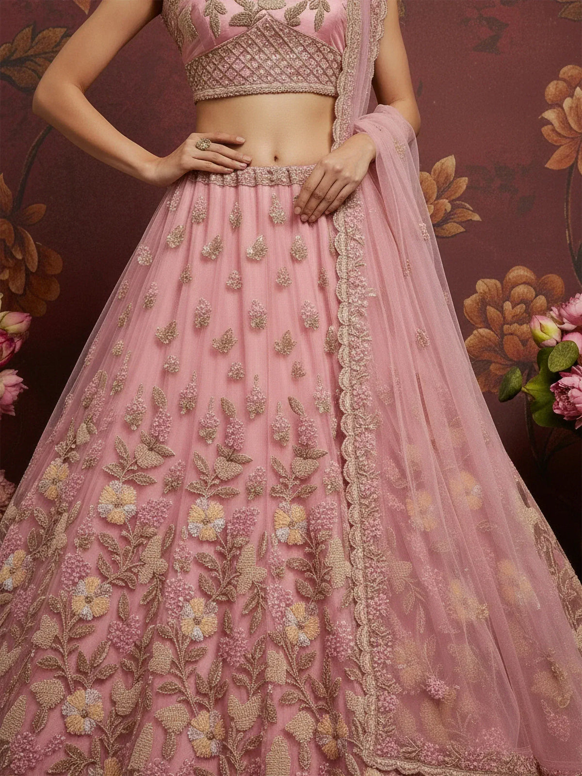 Pink embroidered lehenga choli with floral appliqué, perfect for Indian weddings and festive occasions
