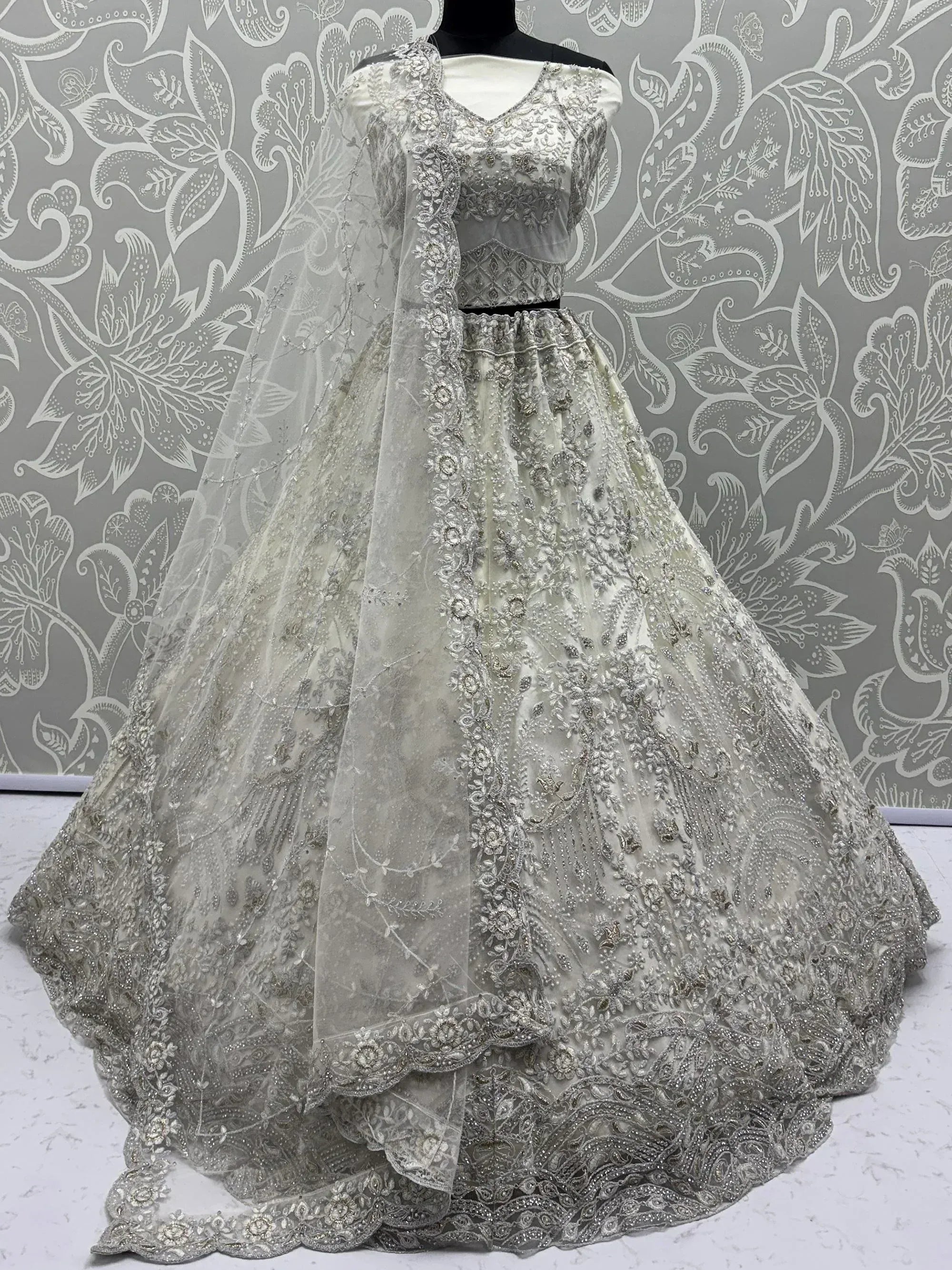 Awesome White Thread Embroidered Net Engagement Wear Lehenga Choli 