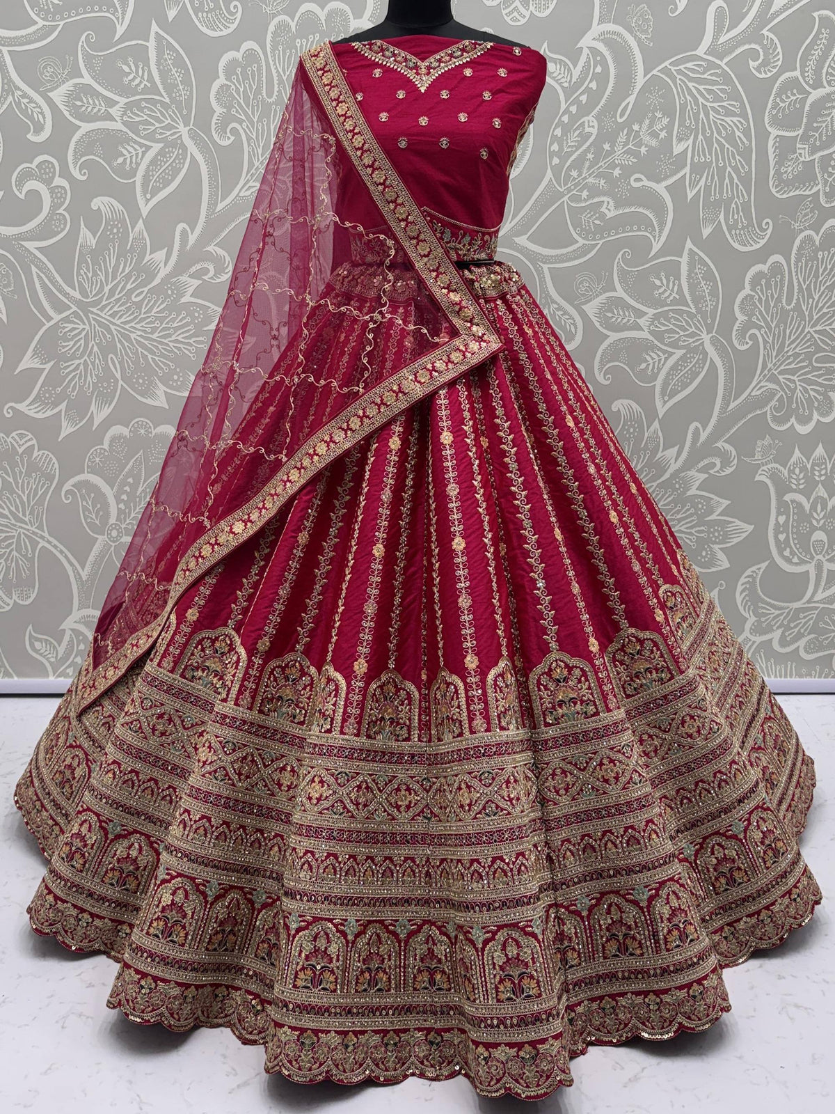Red designer lehenga choli with gold embroidery and matching dupatta for Indian ethnic wear