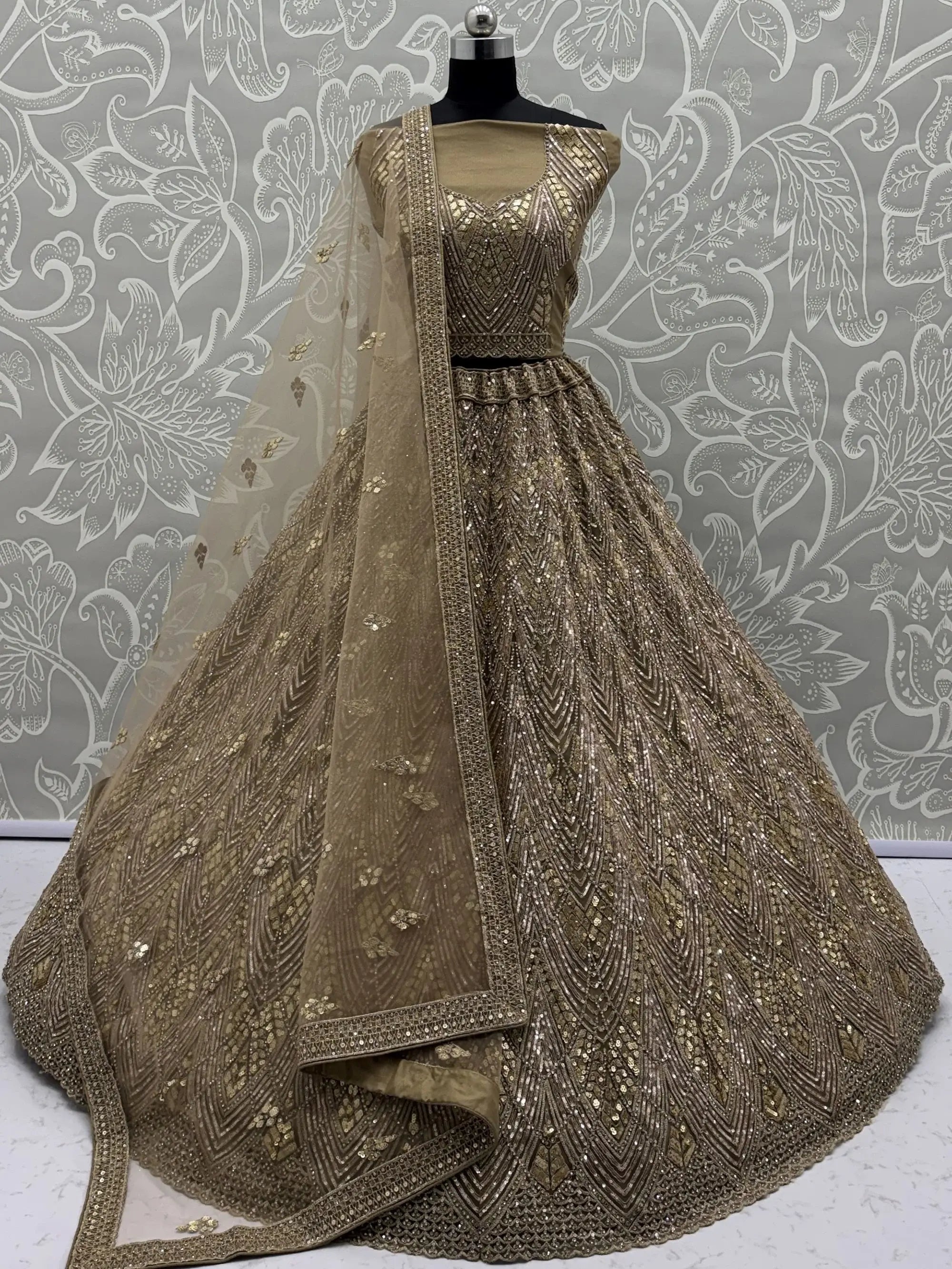 Wonderful Golden Sequins Embroidered Net Reception Wear Lehenga Choli