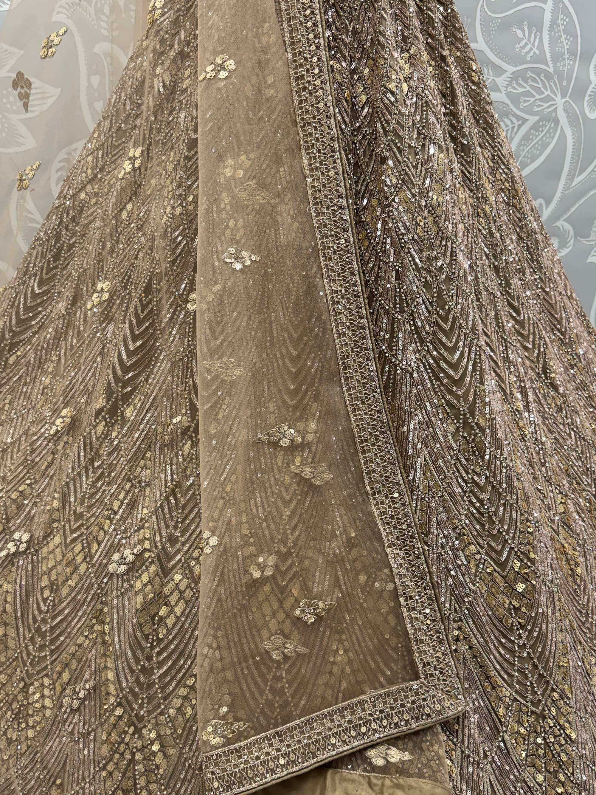 Wonderful Golden Sequins Embroidered Net Reception Wear Lehenga Choli