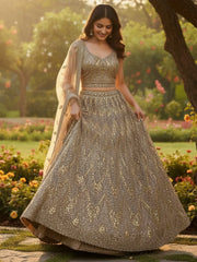 Wonderful Golden Sequins Embroidered Net Reception Wear Lehenga Choli