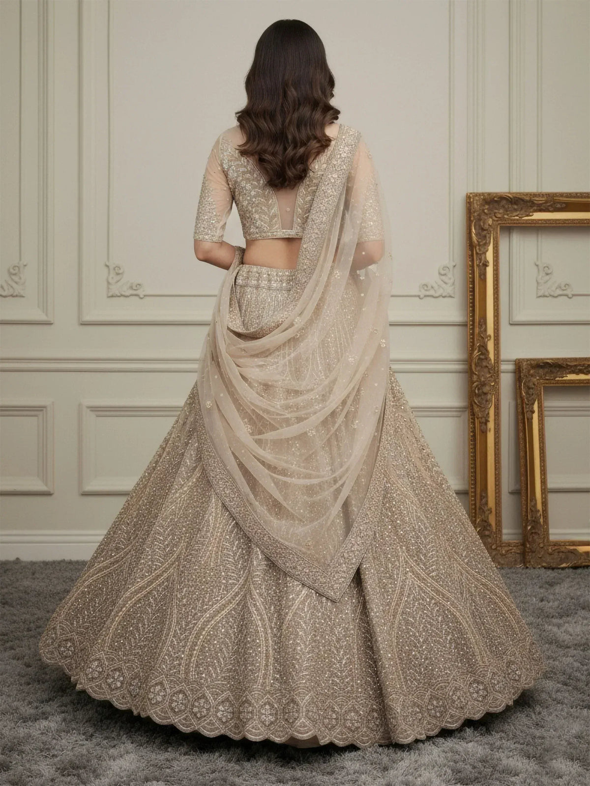 Elegant beige lehenga choli with intricate embroidery and sheer dupatta, perfect for Indian weddings and festive occasions.
