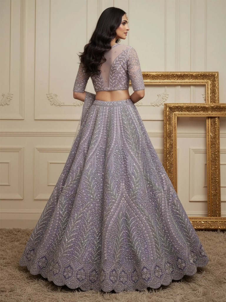 Wonderful Purple Sequins Embroidered Net Reception Wear Lehenga Choli 