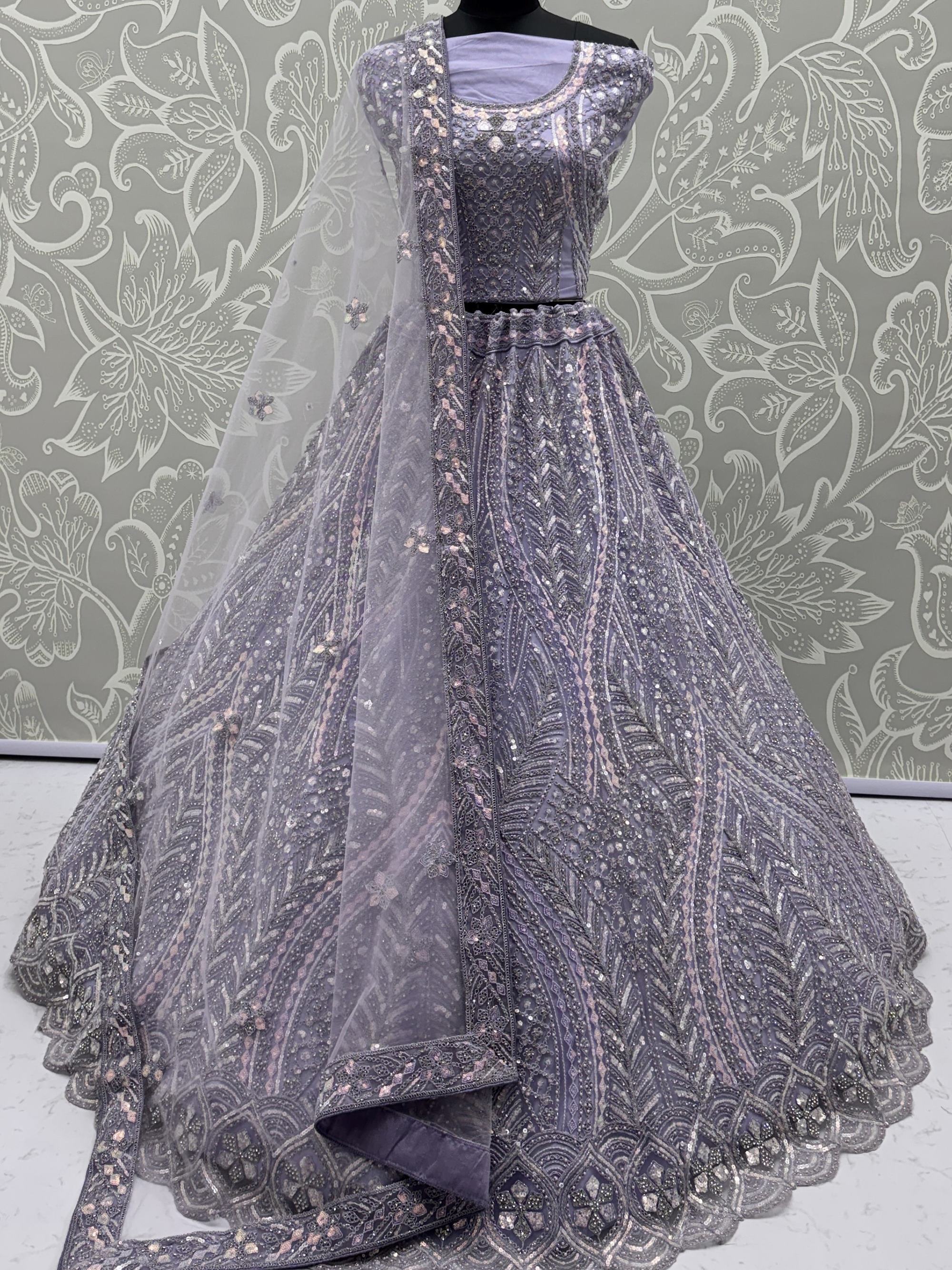 Wonderful Purple Sequins Embroidered Net Reception Wear Lehenga Choli 