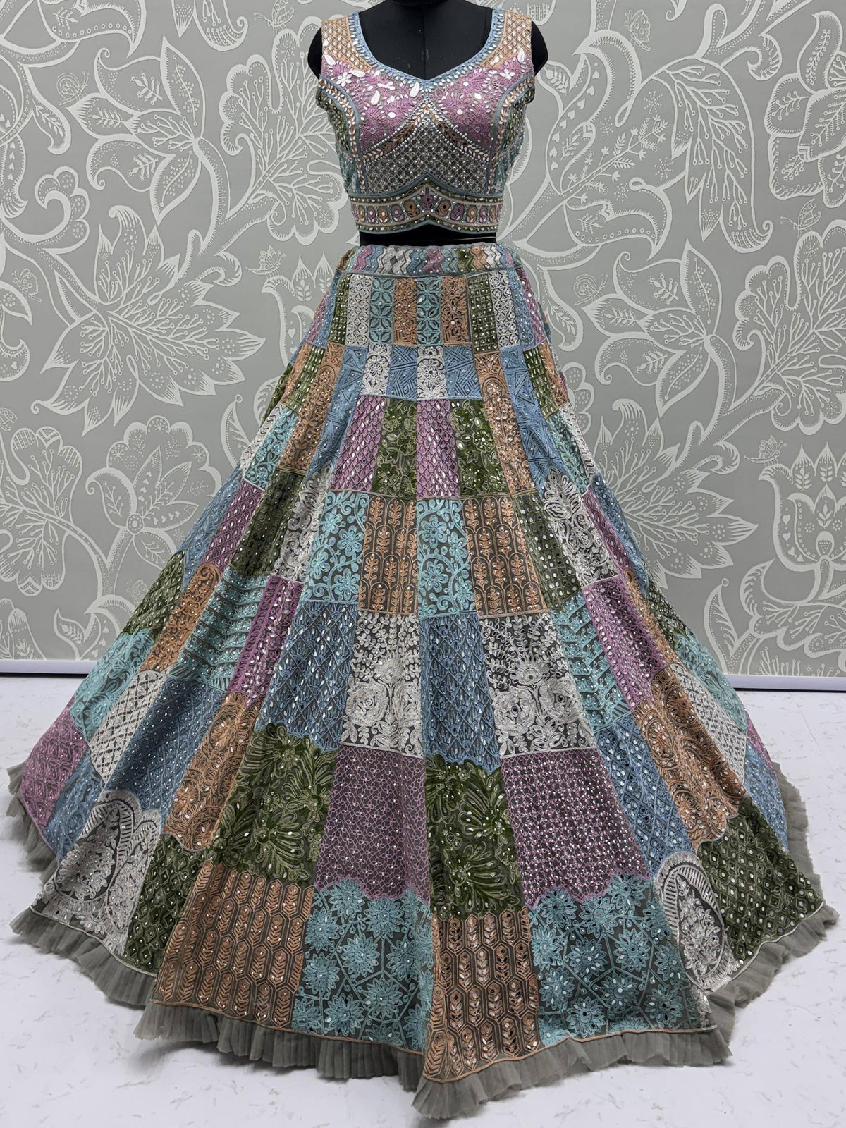 Colorful patchwork lehenga choli with intricate embroidery and sequins for festive occasions