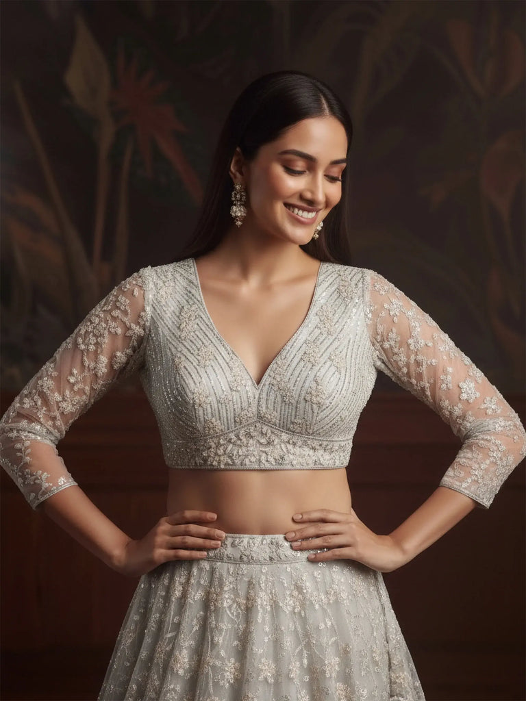 Beautiful White Sequins Embroidered Net Reception Wear Lehenga Choli