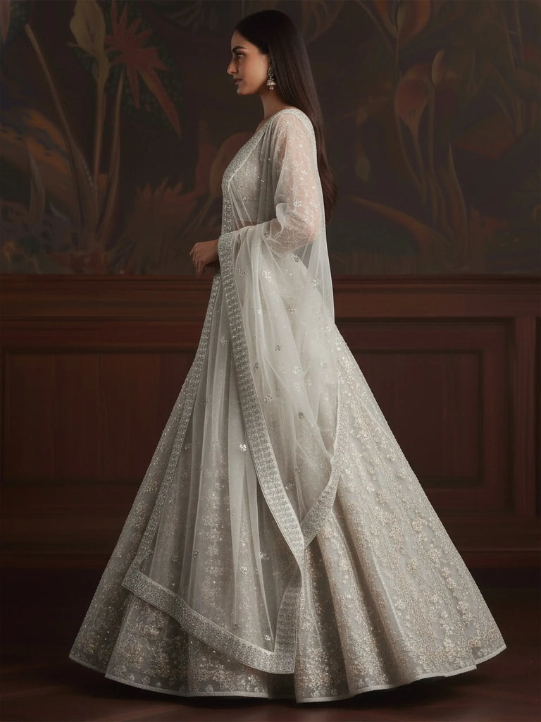 Beautiful White Sequins Embroidered Net Reception Wear Lehenga Choli