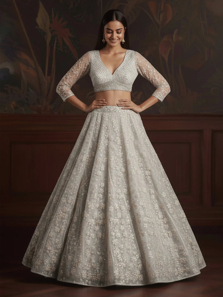 Beautiful White Sequins Embroidered Net Reception Wear Lehenga Choli
