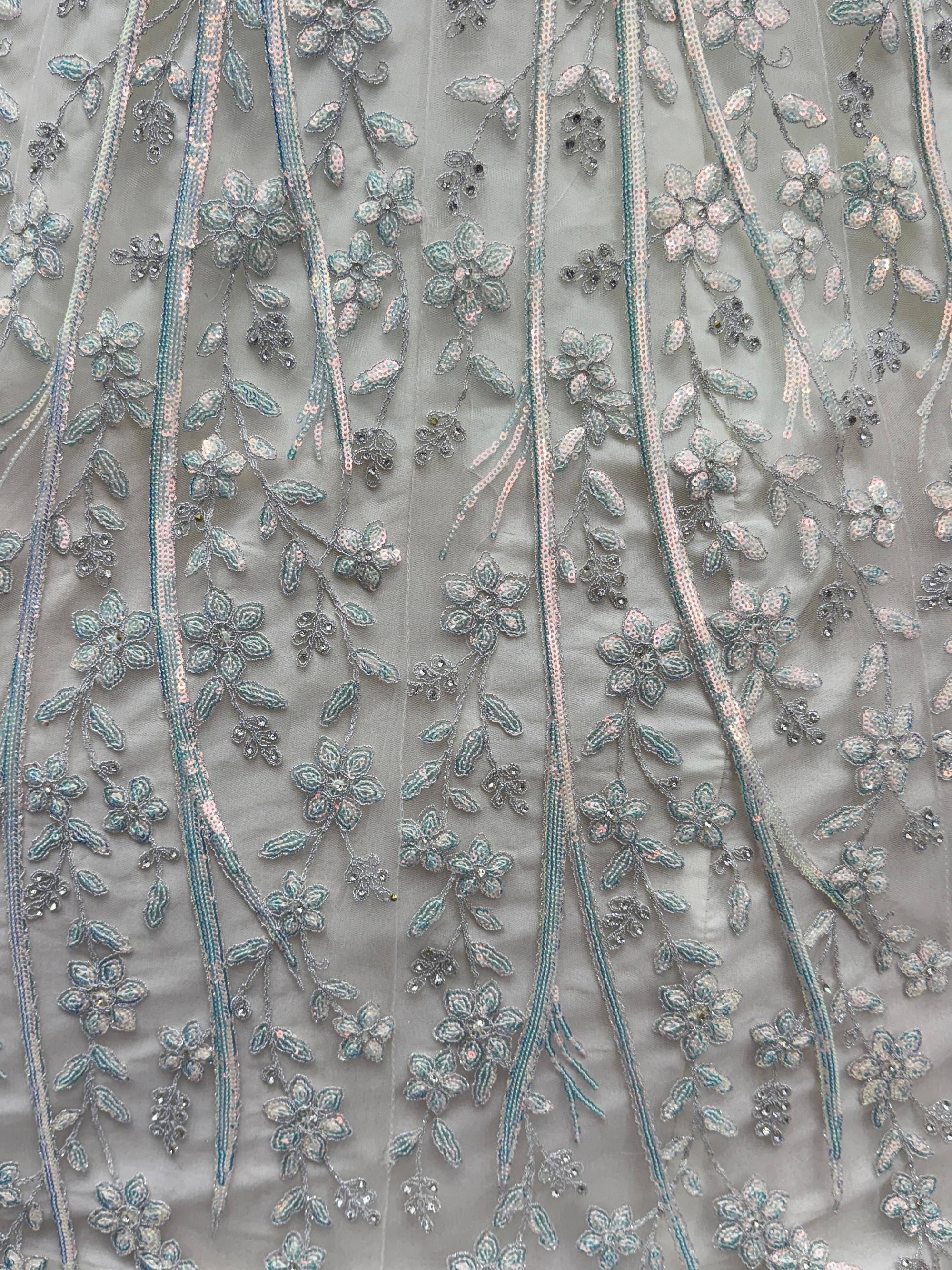 Beautiful White Sequins Embroidered Net Reception Wear Lehenga Choli